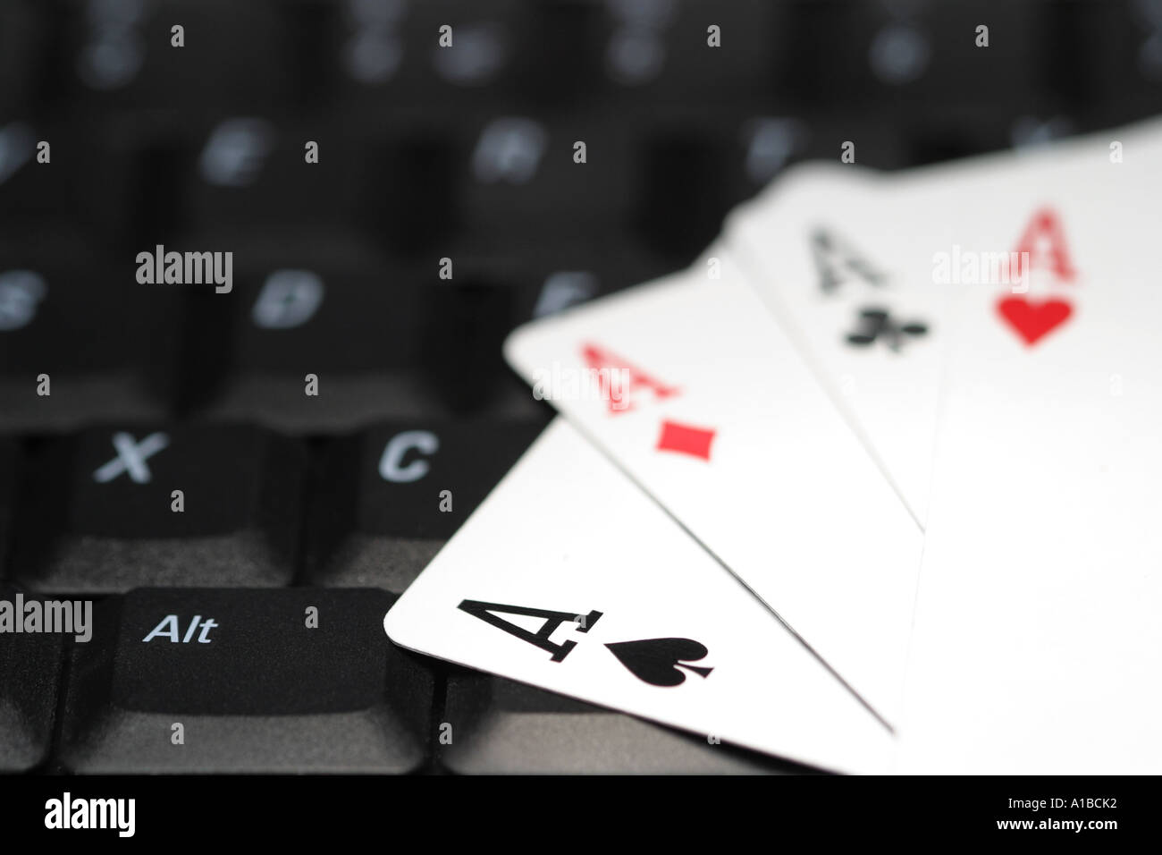 Concept online gambling aces cards and computer Stock Photo