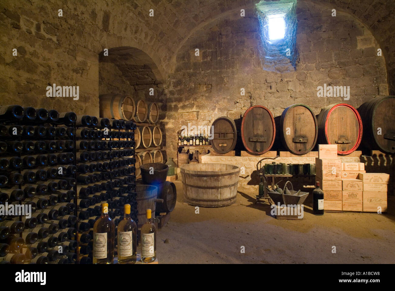 Wine cellar inside a winery in Cazeneuve, Aquitaine, France. Stock Photo