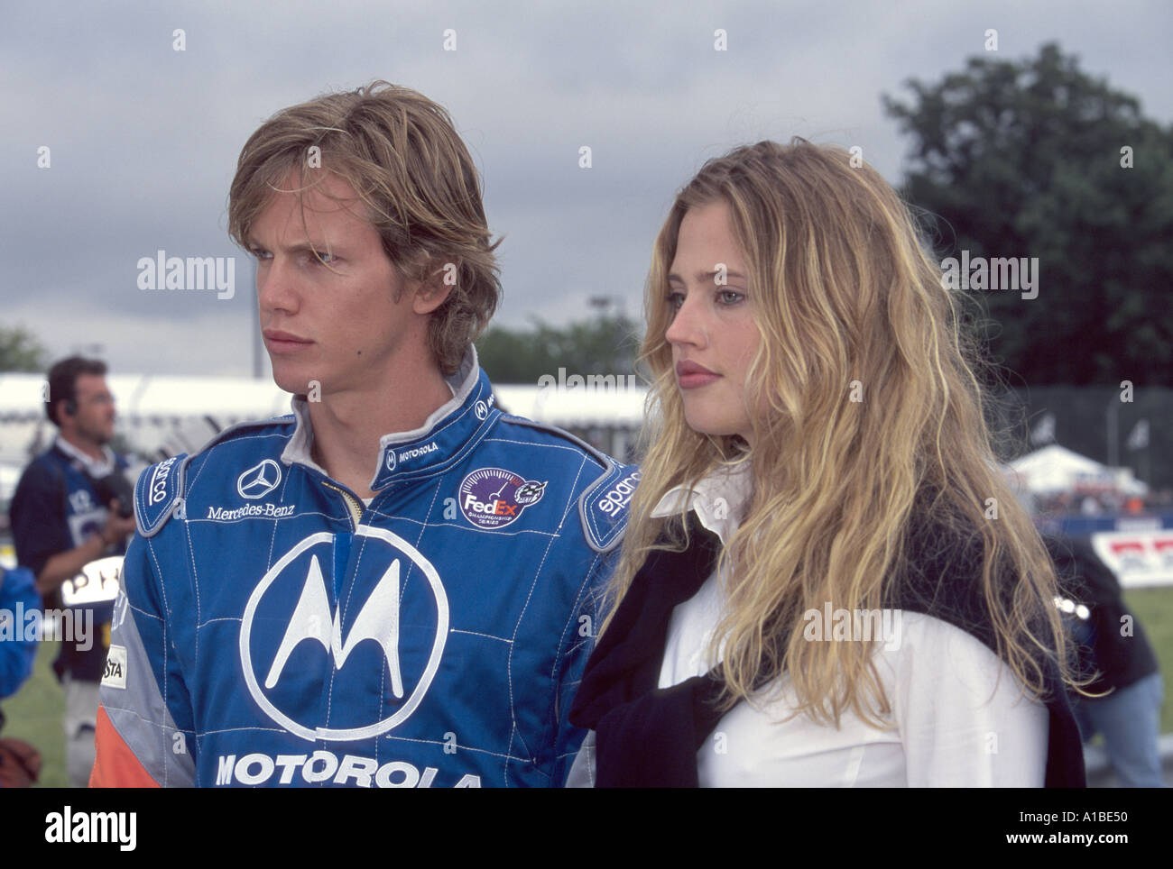 Actors Kip Pardue and Estella Warren during filming of the movie Driven at the Detroit Grand Prix 2000 Stock Photo