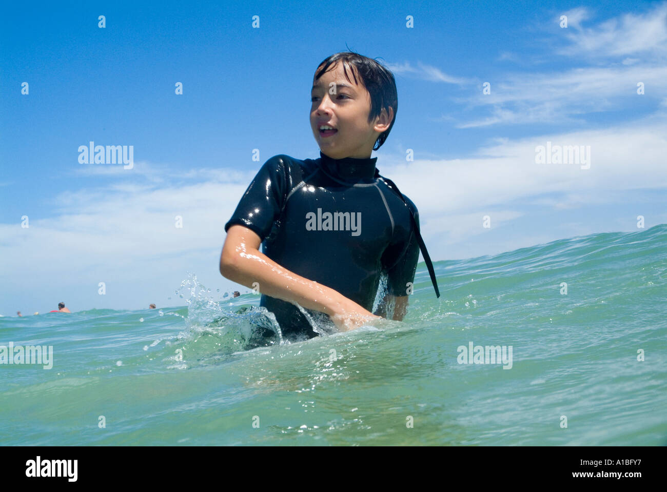 Swimming in a wetsuit hi-res stock photography and images - Alamy