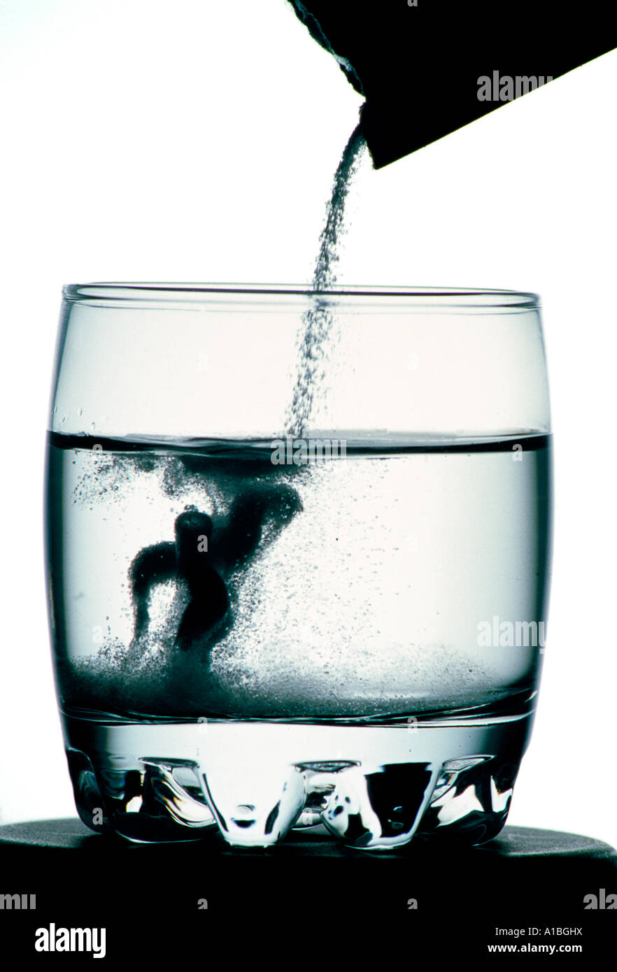 glass of water over a white background with effervescent pills Stock Photo