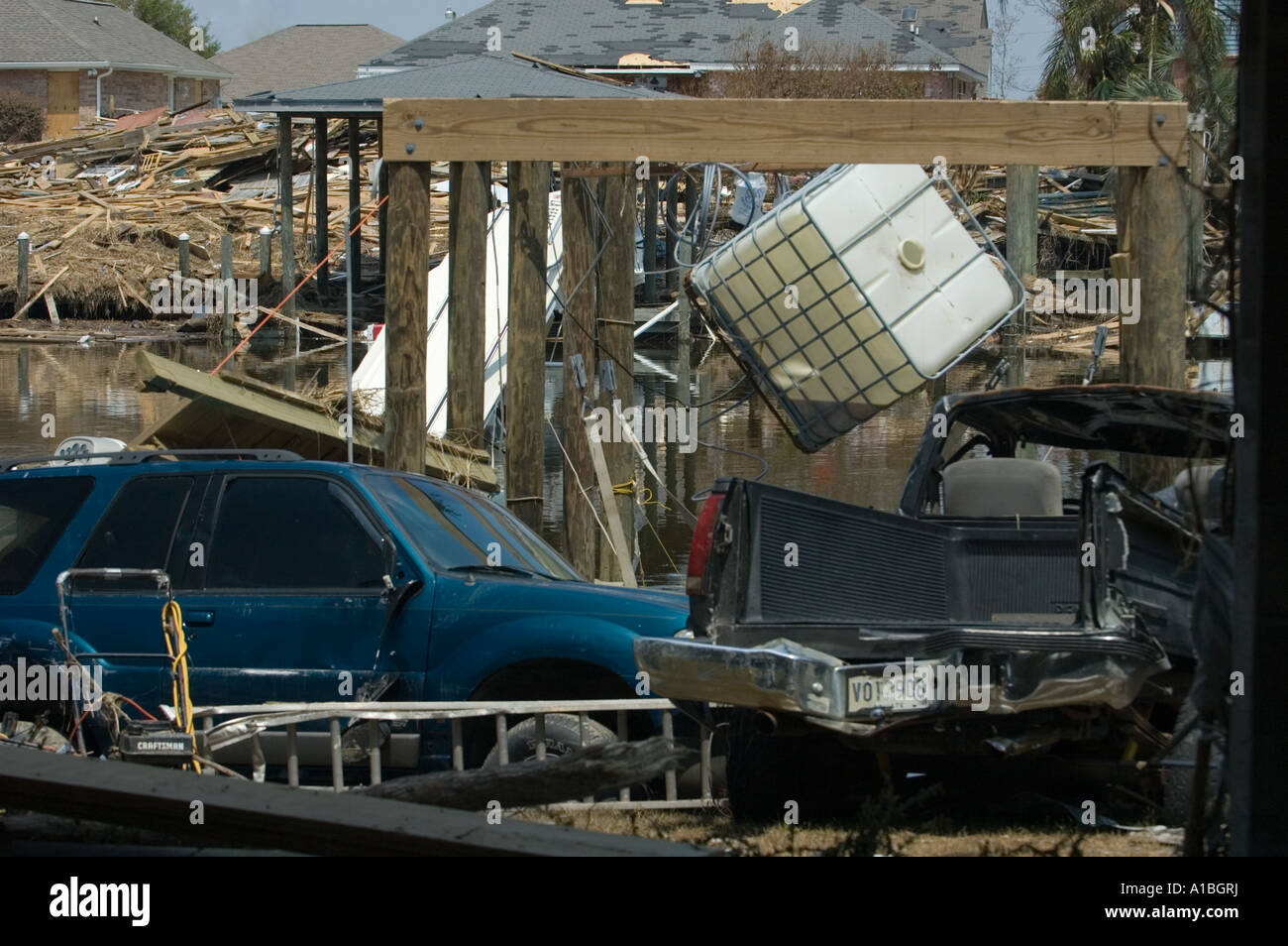 view of Destroyed vehicles on the bank of a river inlet in America in the aftermath of Hurricane Katrina 2005 Stock Photo