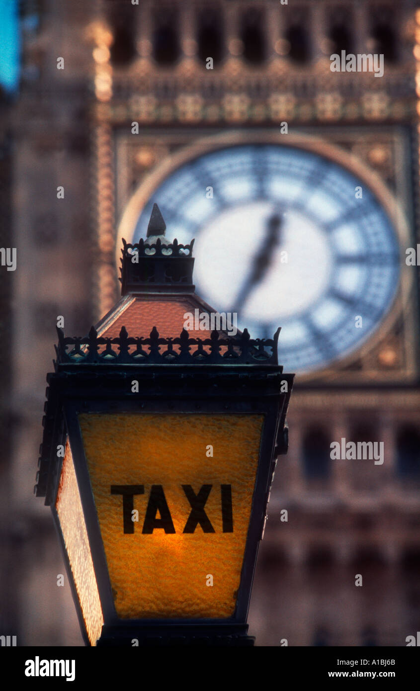 old historical taxi stand lamp sign with clock of Big Ben in background