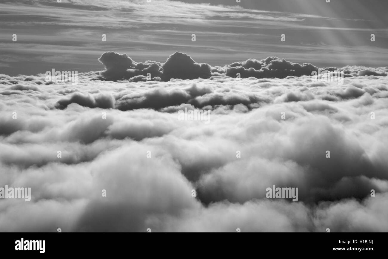 Aerial flying above clouds high Black and White Stock Photos & Images ...