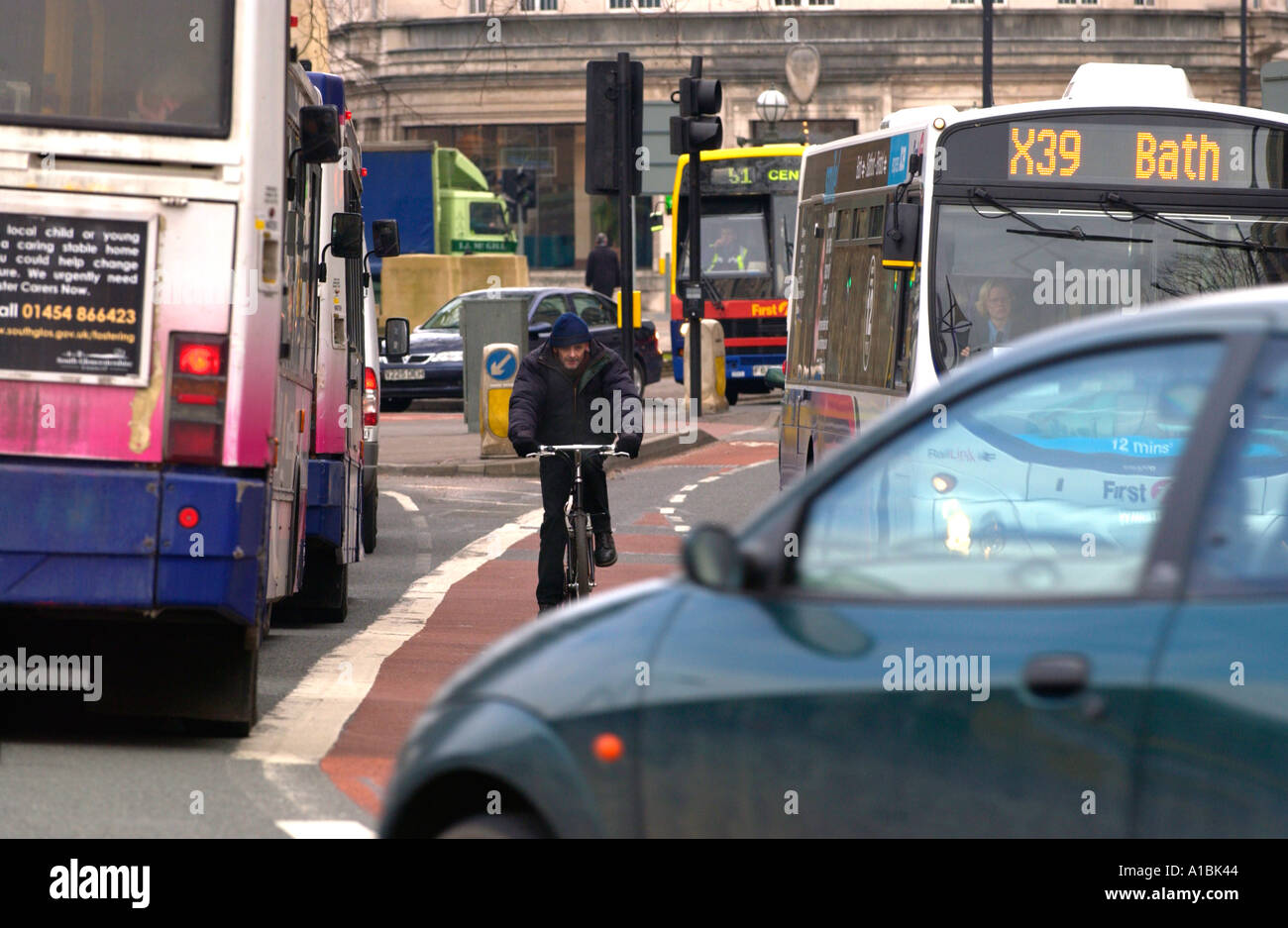 Cyclist using bus lane in Bristol city centre England UK Stock Photo
