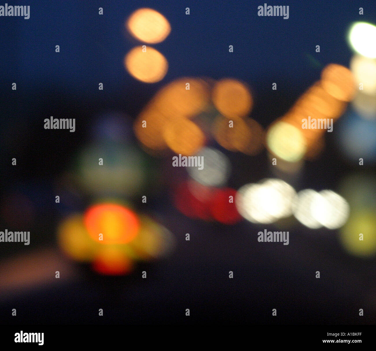 Abstract PSNI police bike returning home in night traffic lights from