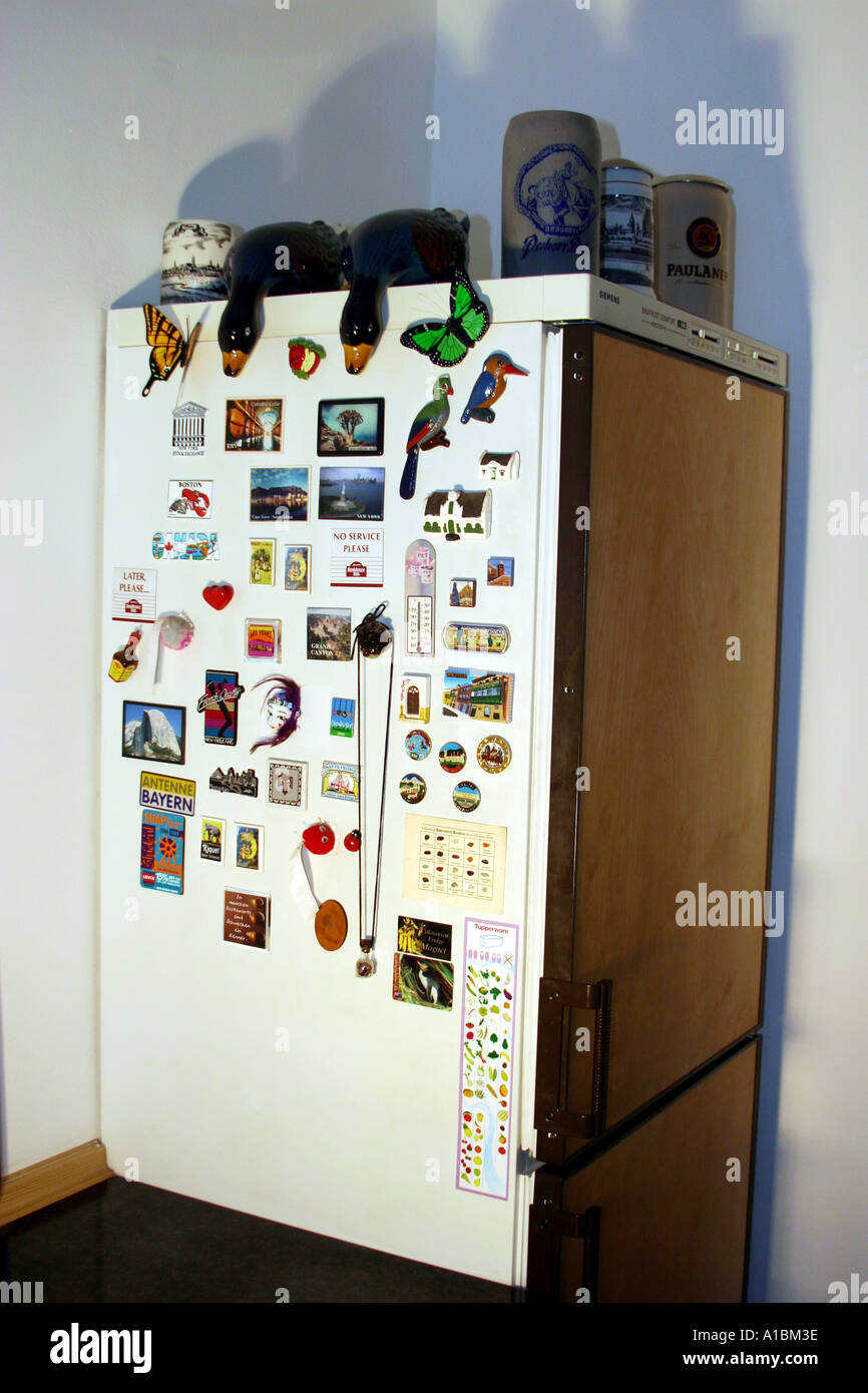 A refrigerator door with multiple magnets and art Stock Photo