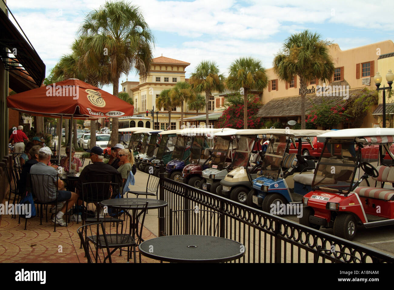 Club carts line the street in Spanish Springs Village Florida . Golf