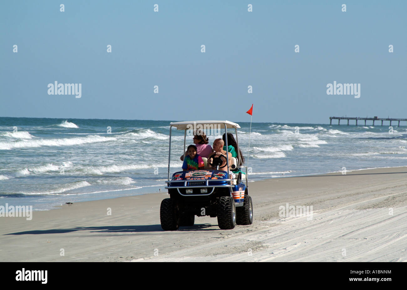 Daytona Beach Florida USA Holiday makers enjoying a drive along the beach  in a rental club cart Stock Photo - Alamy