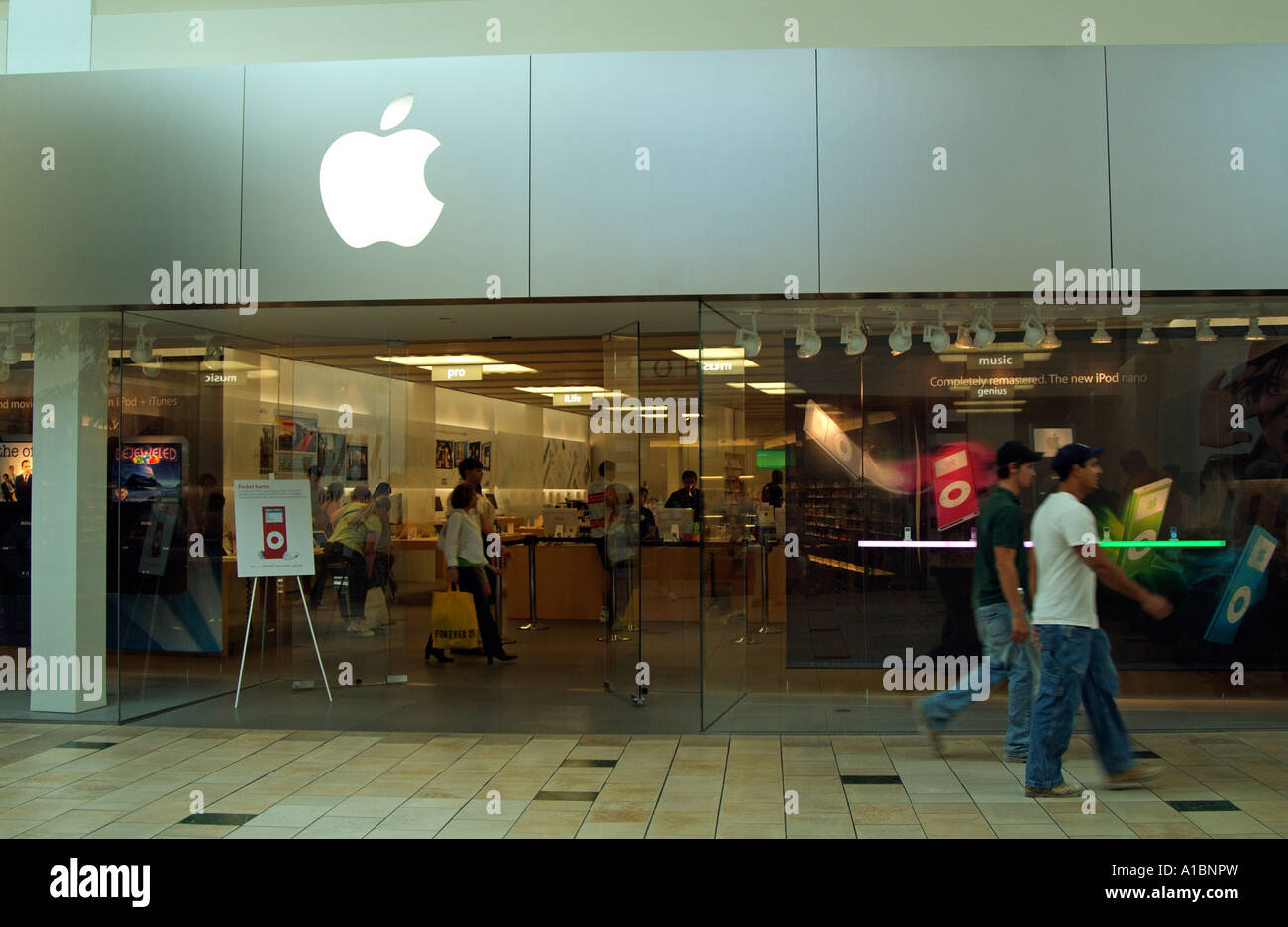 people walking past the apple store at The Florida Mall enclosed shopping  mall orlando Florida USA United States of America Stock Photo - Alamy