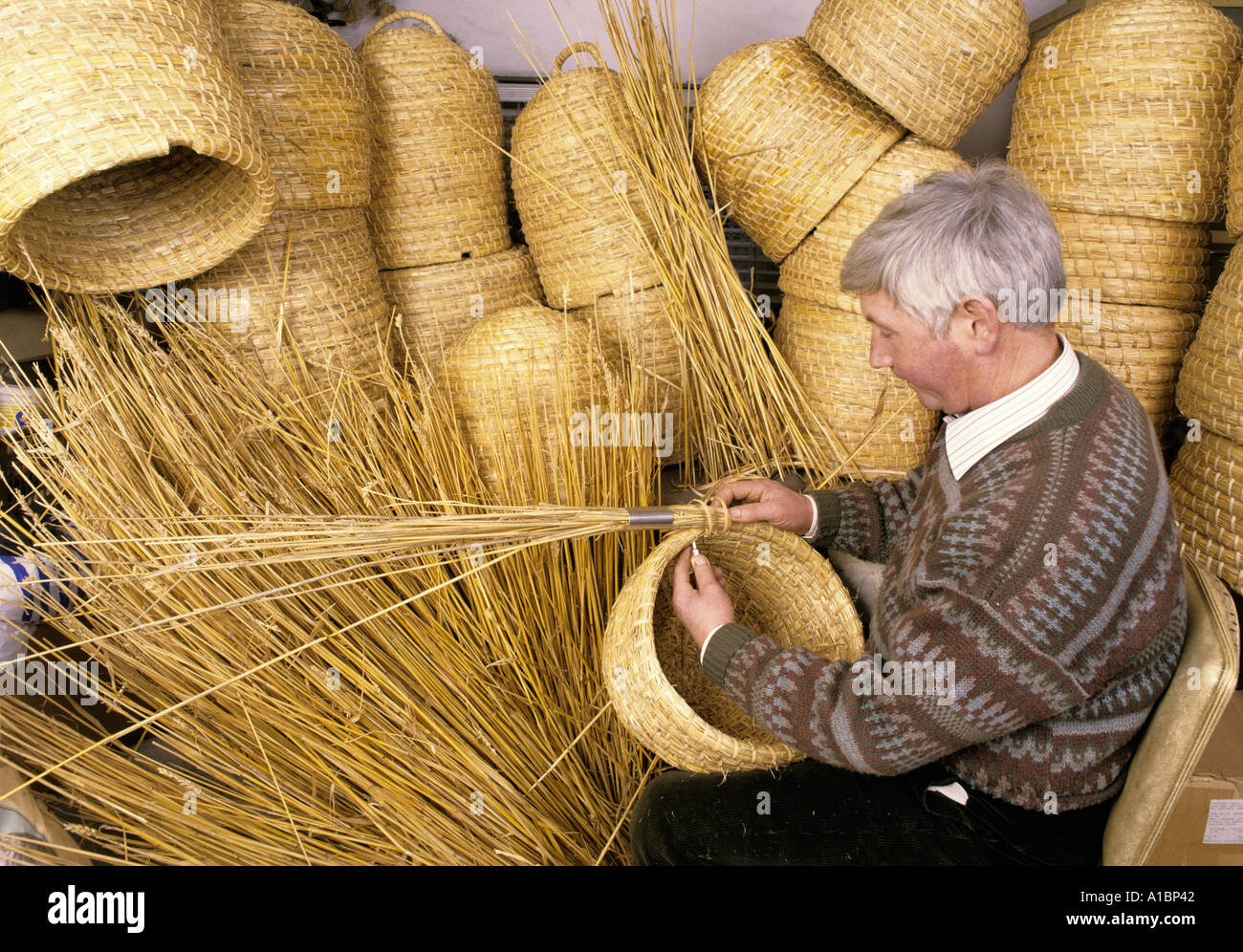 Bee Skep and hives being made from long straw Stock Photo Alamy