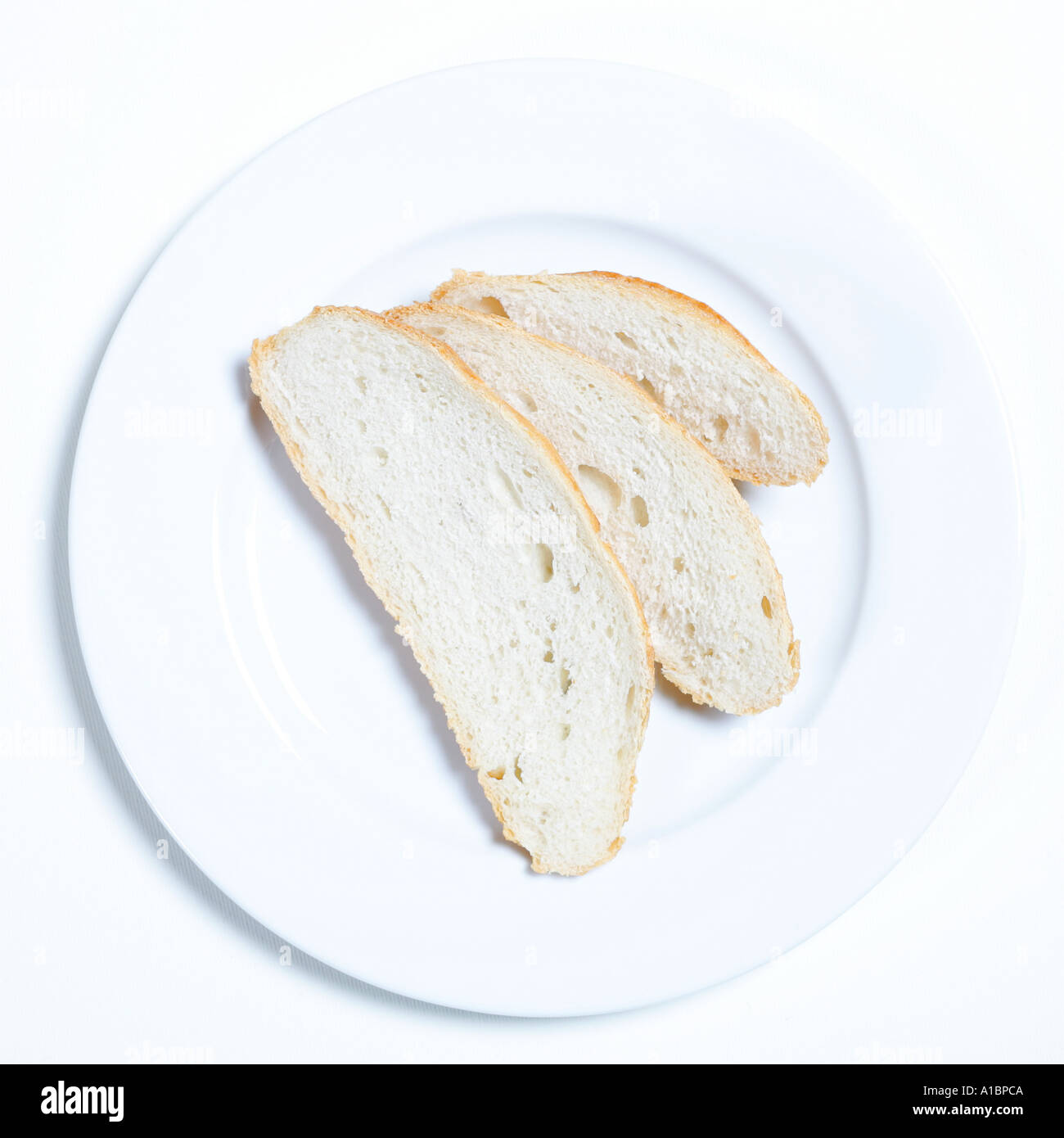Slices of bread on plate Stock Photo
