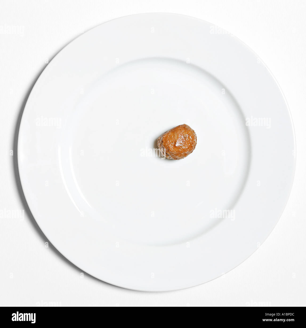 Single meat ball on a plate Stock Photo