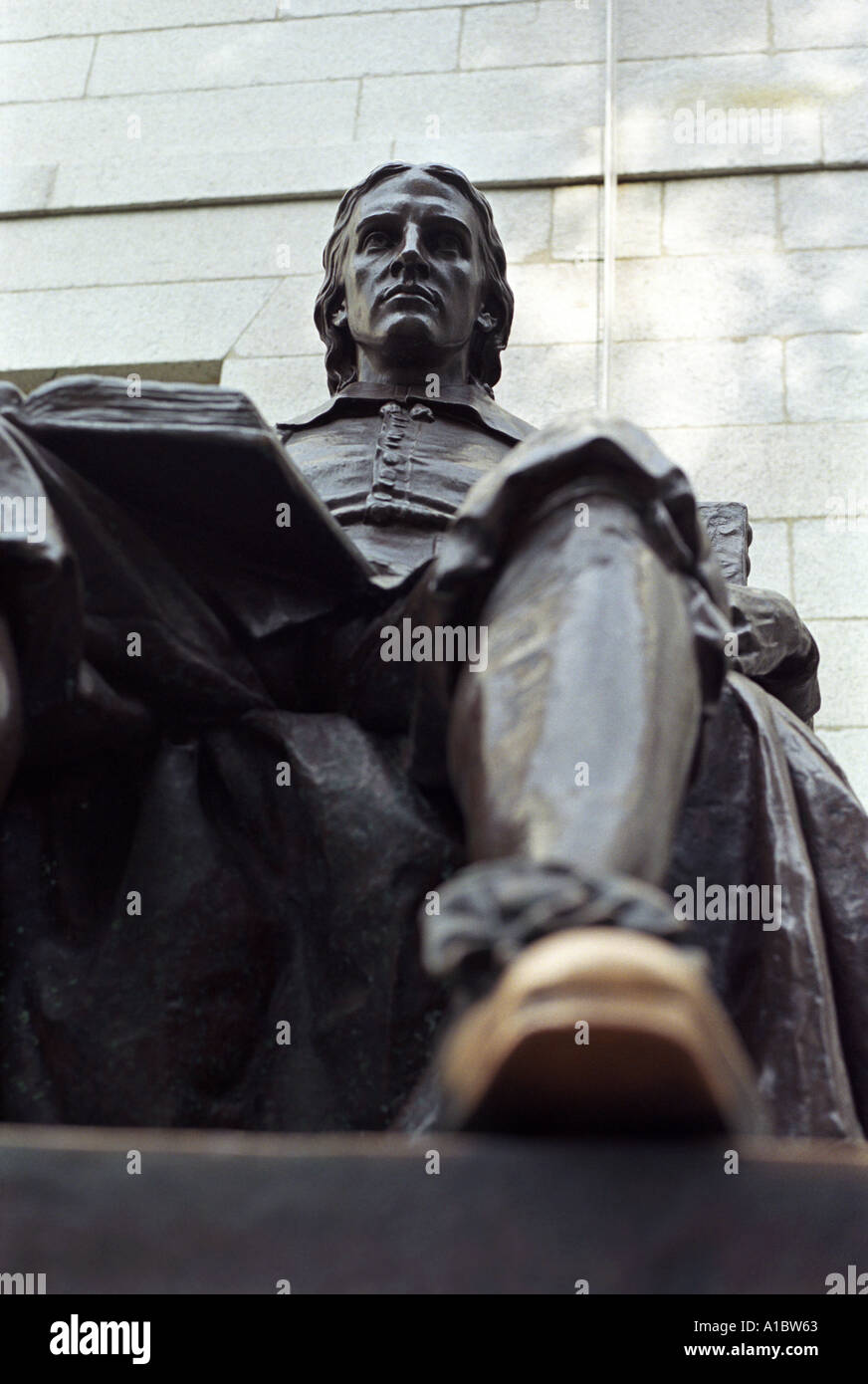 The statue of founder John Harvard in Harvard University Cambridge Massachusetts Stock Photo