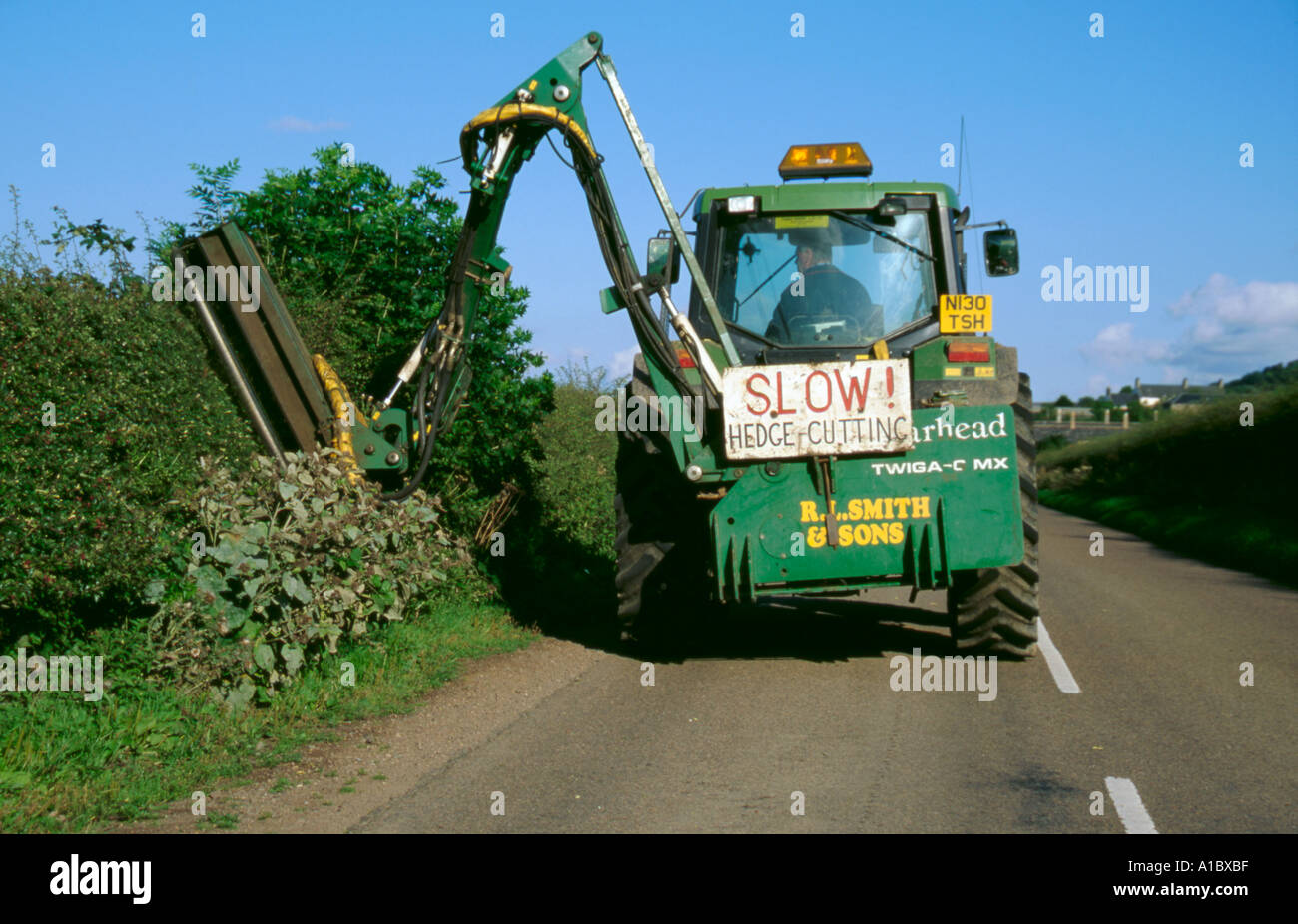 Tractor mounted hedge trimming machine, Northumberland, England, UK