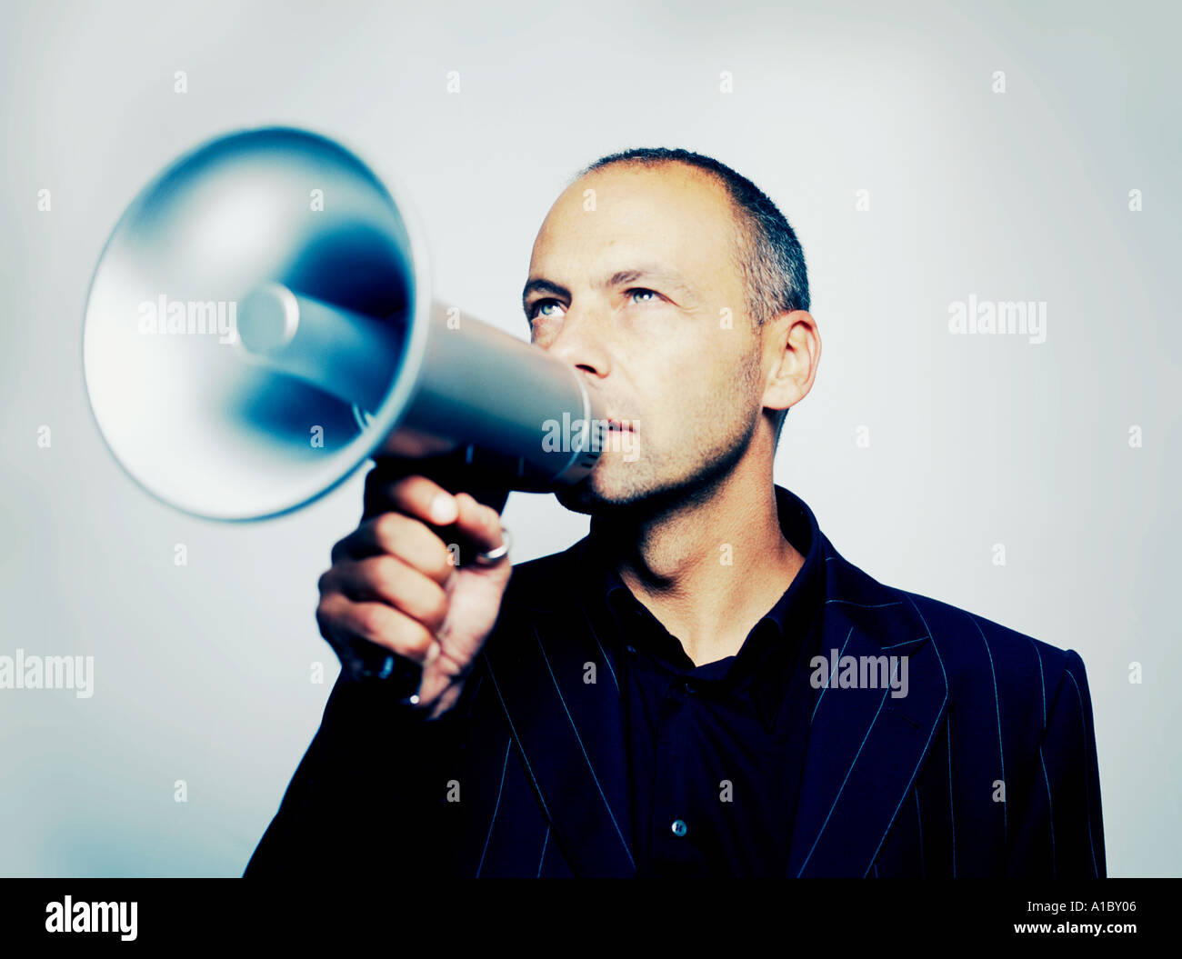 man using a megaphone Stock Photo - Alamy