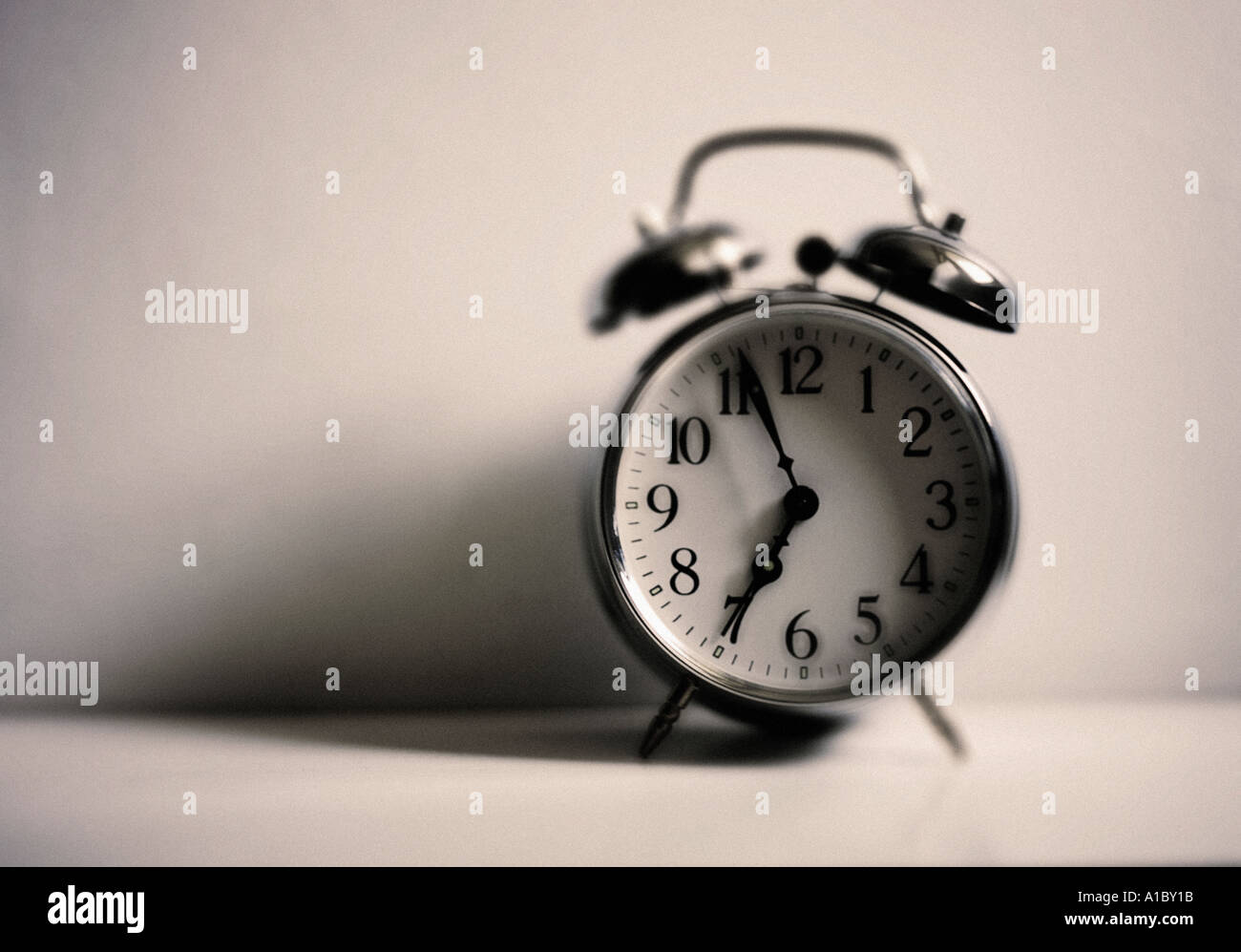 an old fashioned chrome alarm clock Stock Photo Alamy