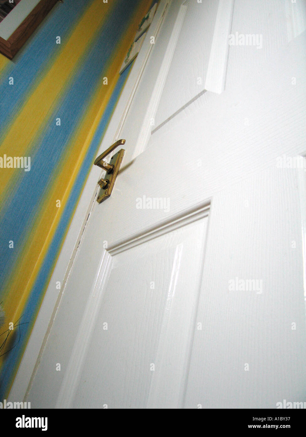 Domestic internal six panel door with brass handle Stock Photo