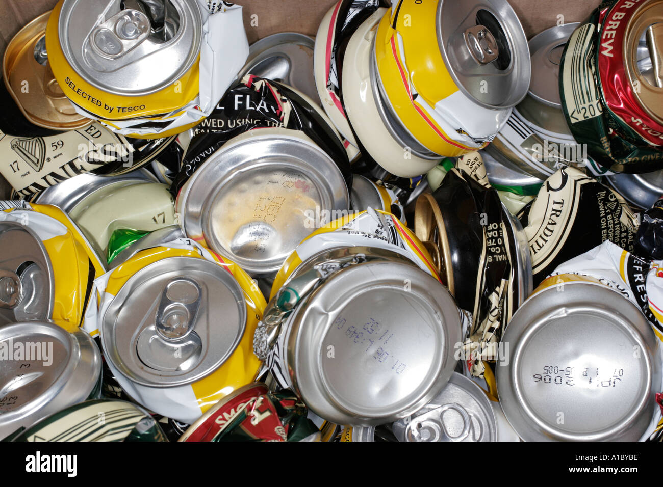 Crushed drink beer cans ready to be recycled tin steel aluminium aluminum environment environmental Stock Photo