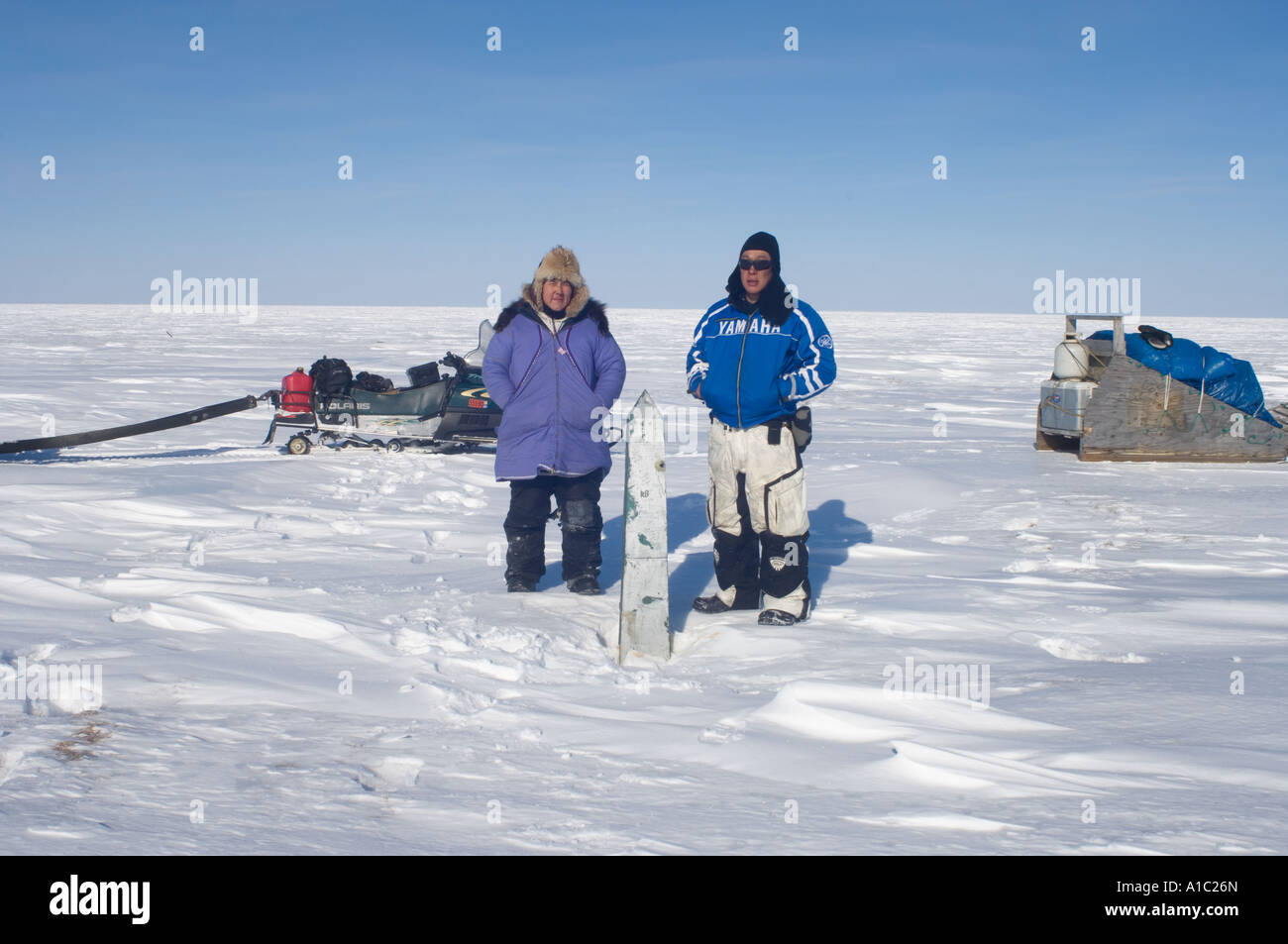 Inupiat couple straddles the US Canadian border along the Arctic coast ...