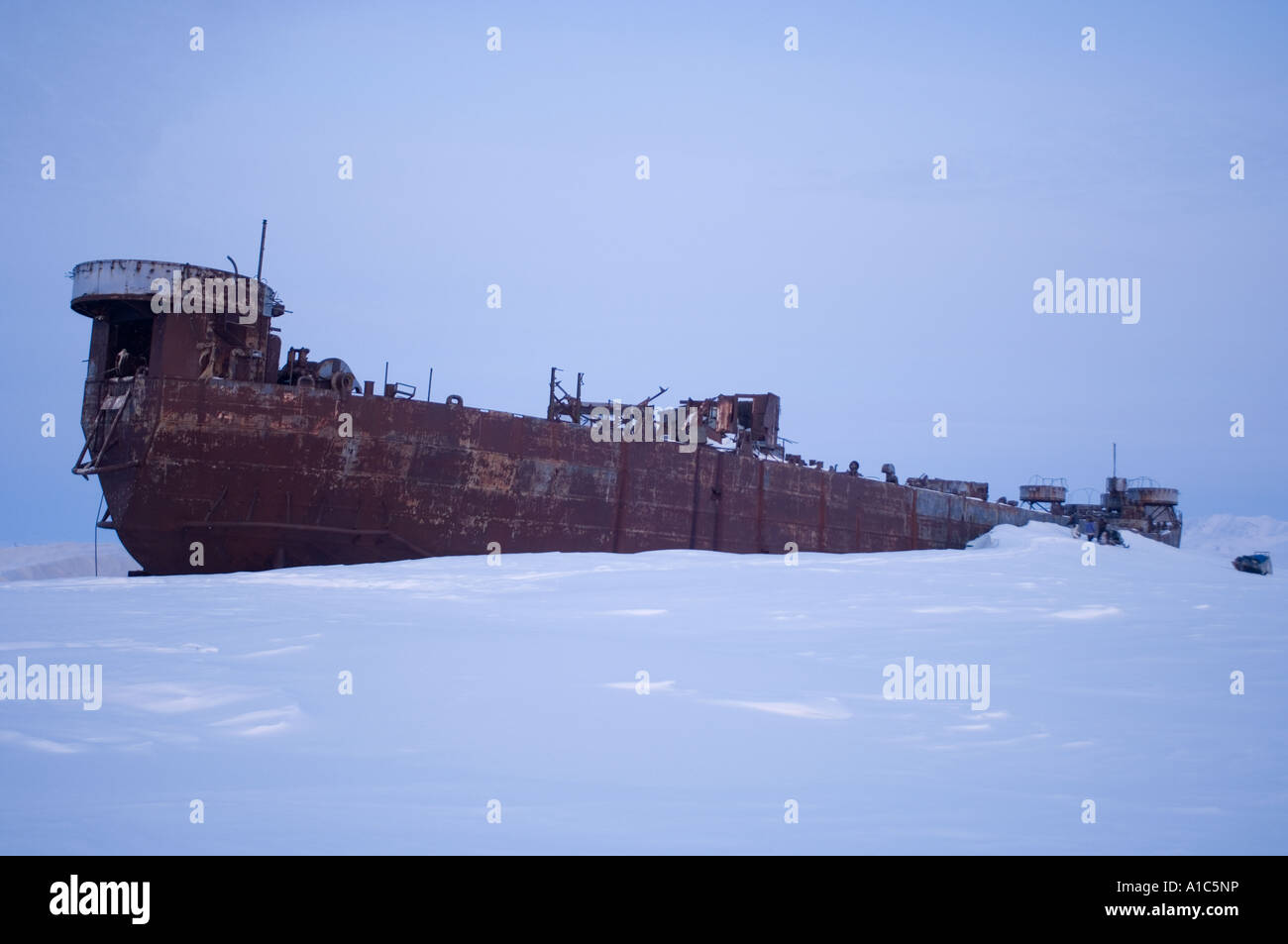 old ship permanently stranded along the Arctic coast at Demarcation Point between Alaska and Canada Stock Photo