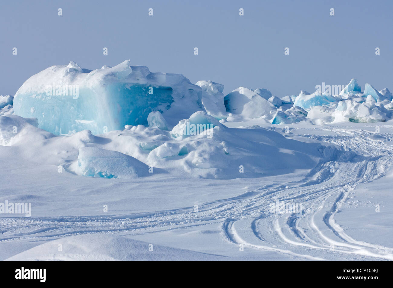 snow machine tracks through jumbled ice in the frozen Chukchi Sea off