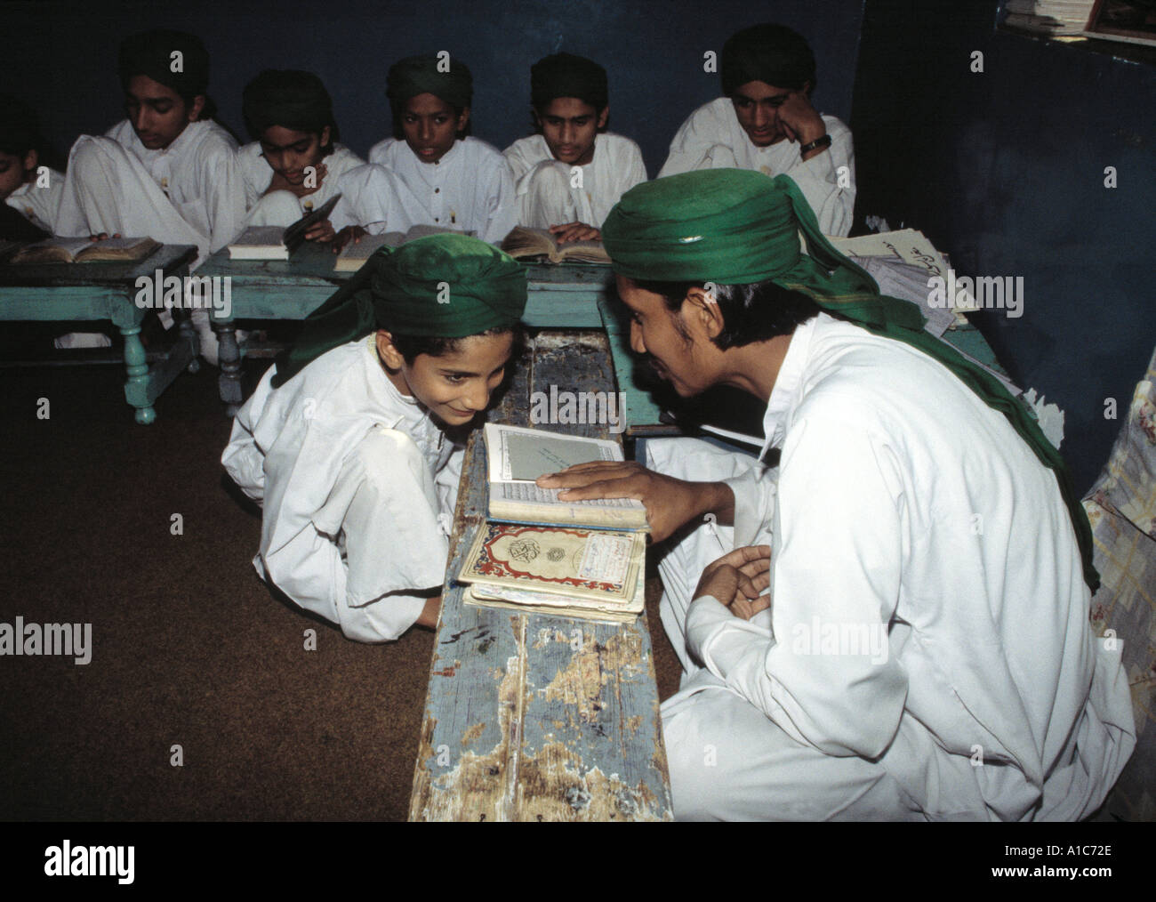 Young boys and teacher in an Islamic religious school or madrassa in