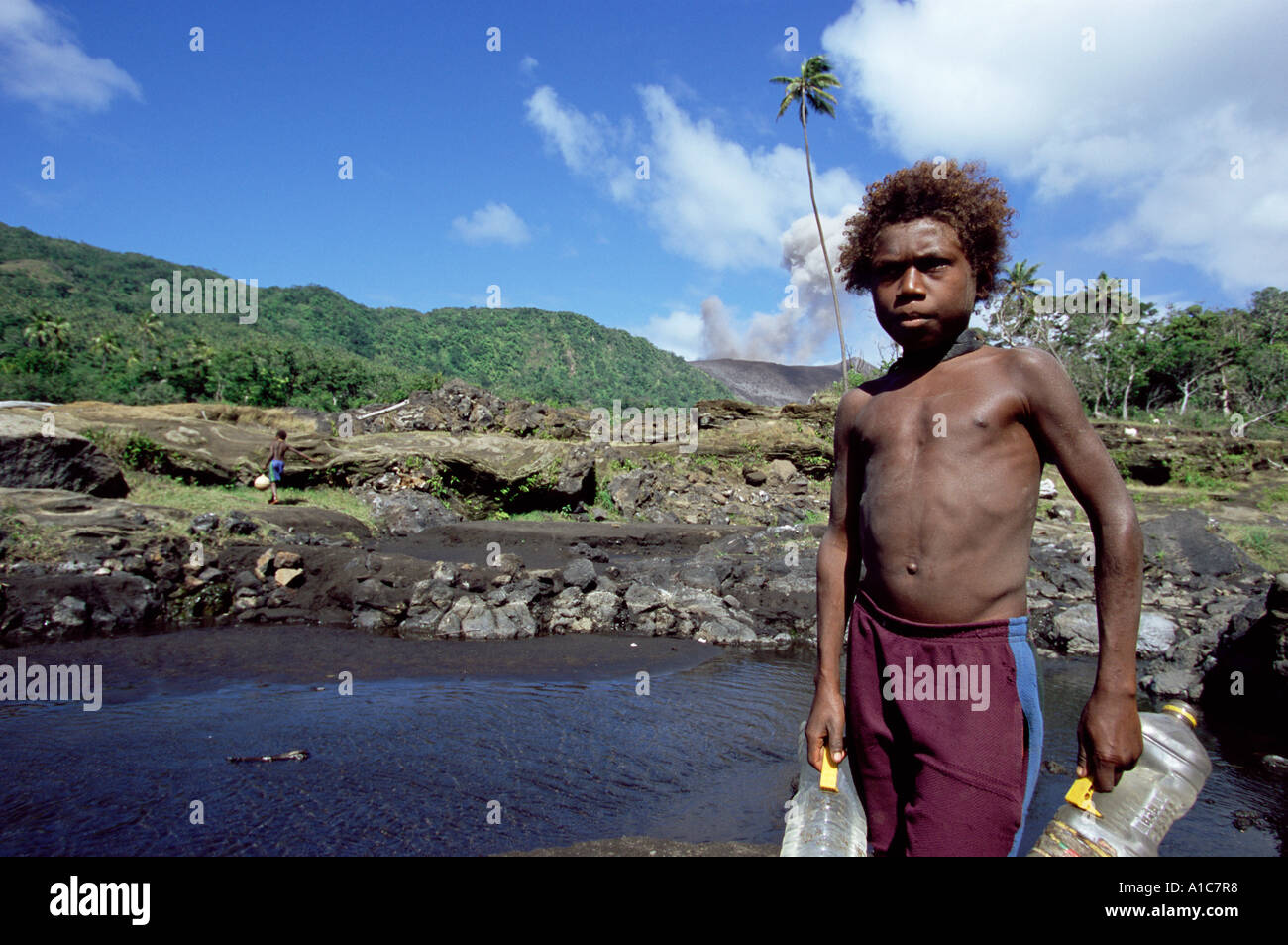 Vanuatan Boy Collecting Water Stock Photo
