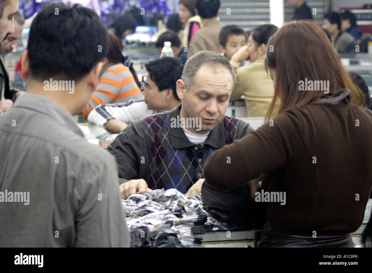 An international buyer of fake watches in Wangjiao Horological Market in Guangzhou, China Stock