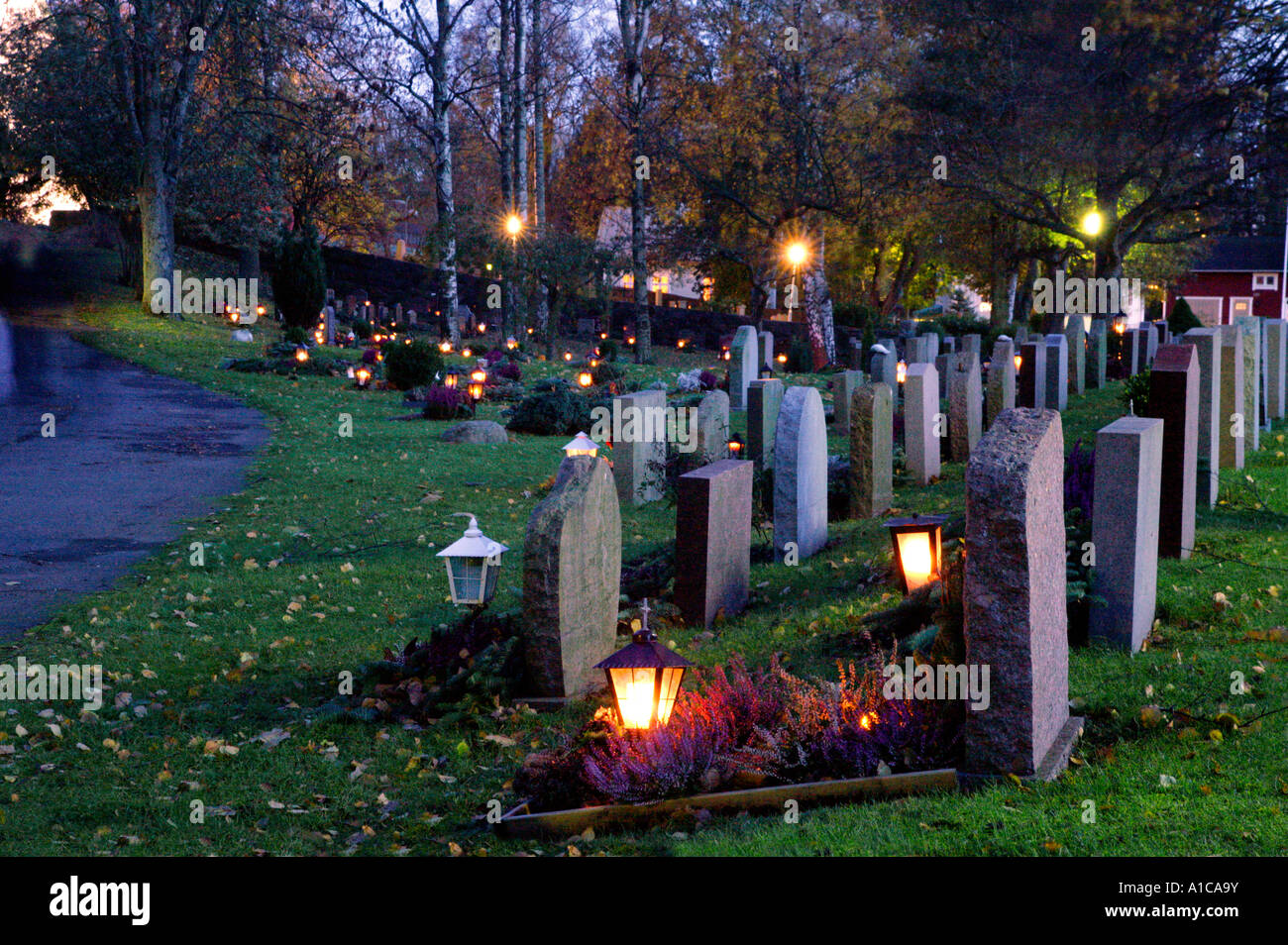 Christian graveyard by night on All Saints Day. Stock Photo
