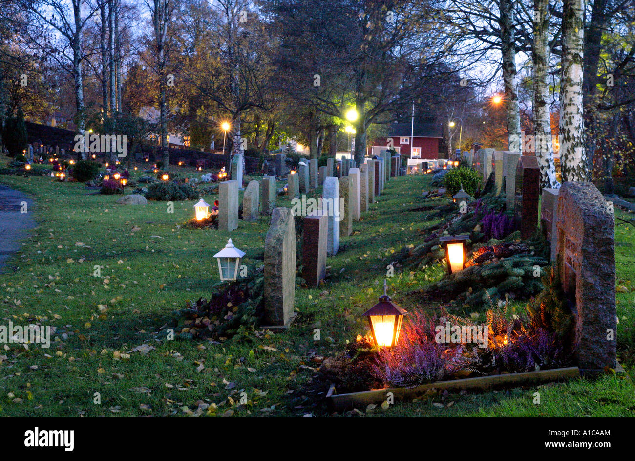 Christian graveyard by night on All Saints Day. Stock Photo