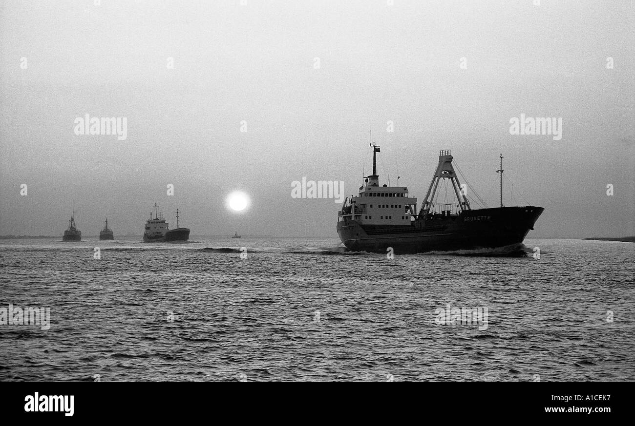Ships sailing out of river Humber on an evening tide. Stock Photo