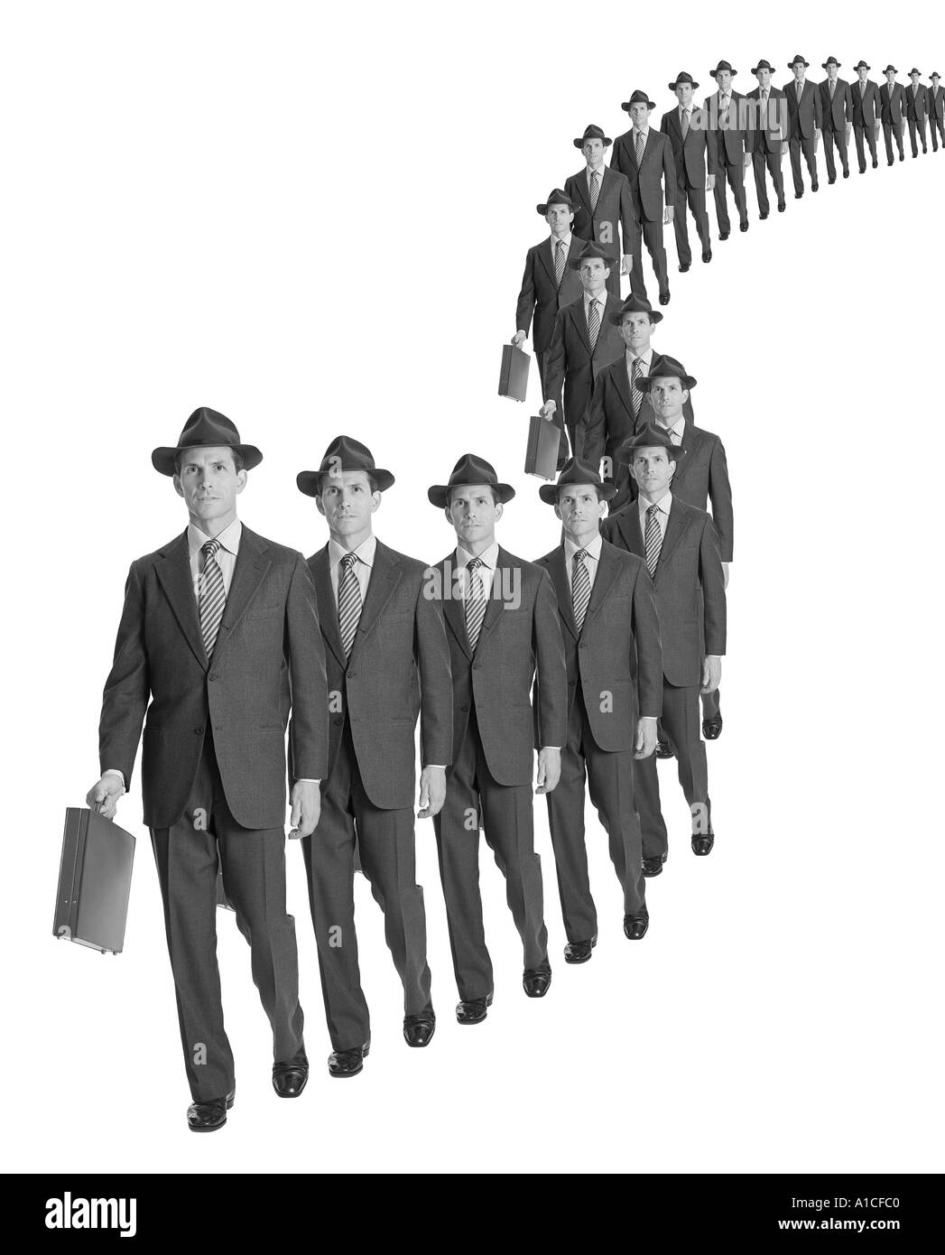 Row of stereotypical cloned businessman against white background Stock Photo