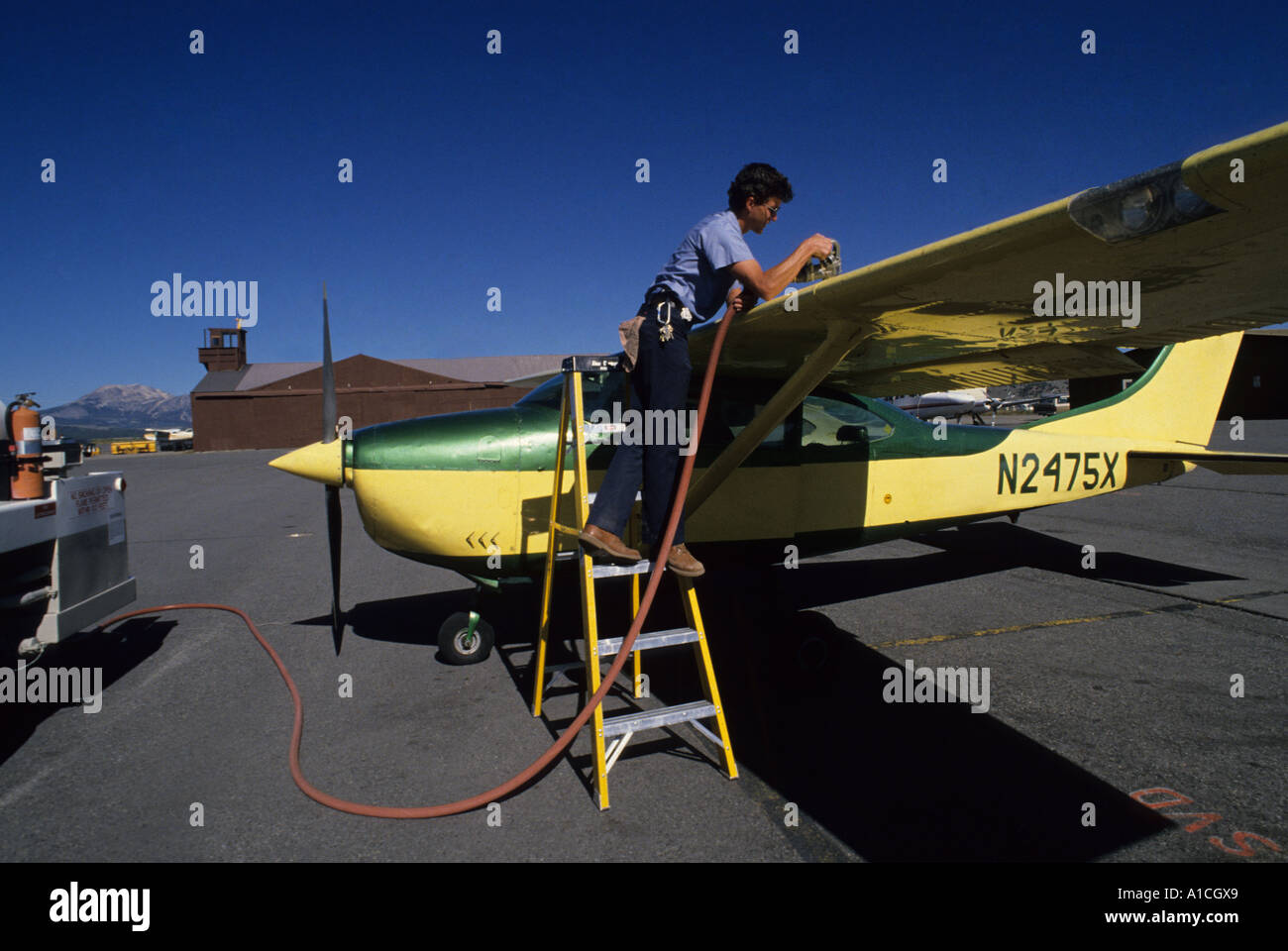 Refueling small airplane.  Mammoth Lakes, California Stock Photo