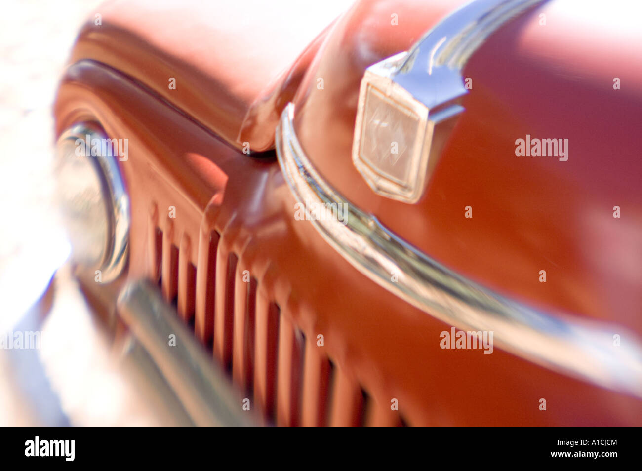 Close-up shot of the front end of a red 1950 International truck. Stock Photo