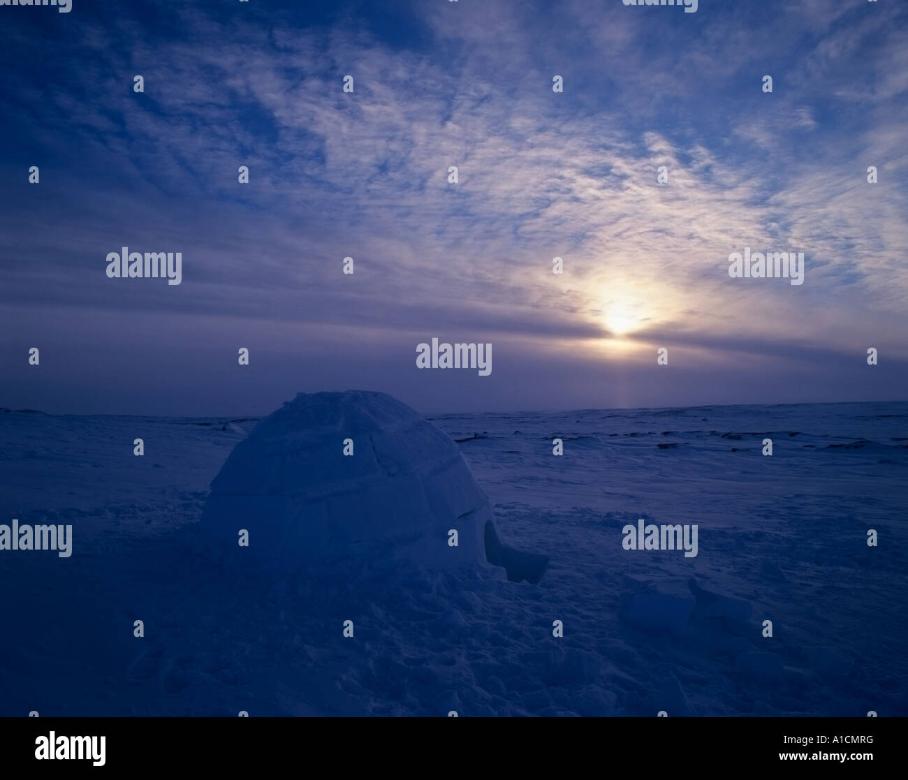 A sunset over an igloo in the Canadian Arctic. Stock Photo