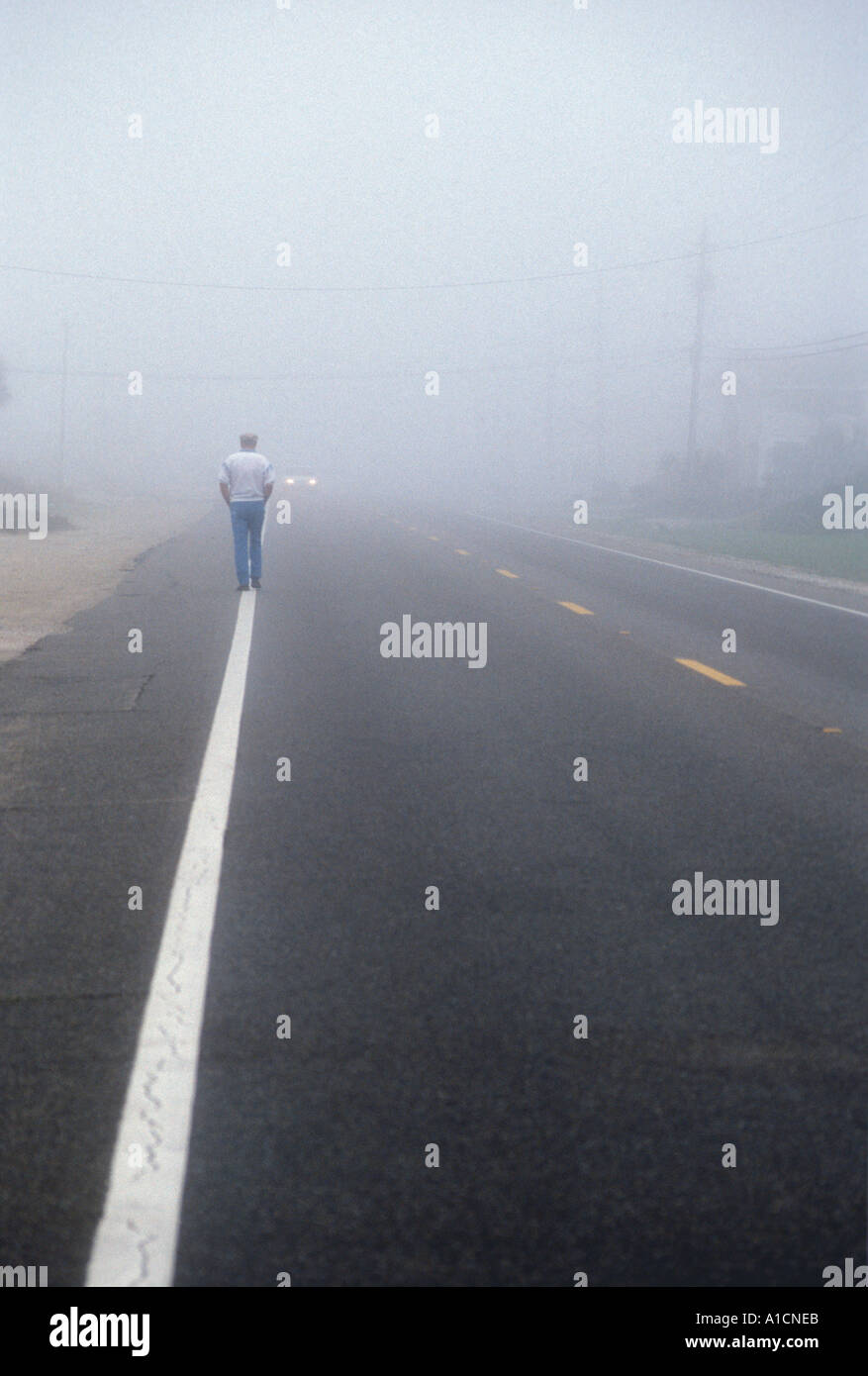 Man Walking in Fog Stock Photo