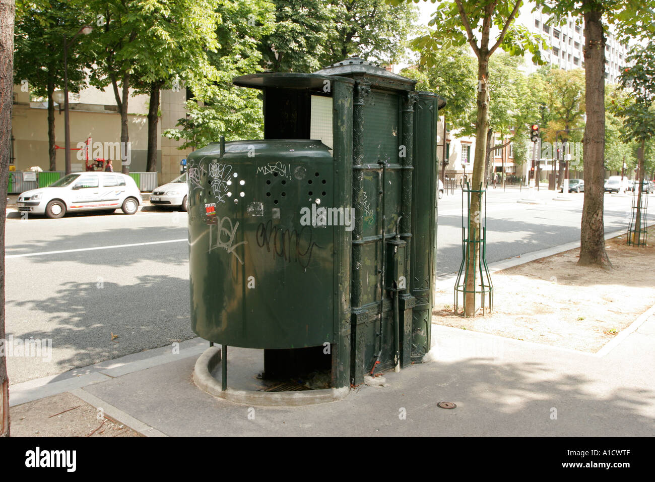 Traditional original pissoir public toilet in the street in Paris Stock