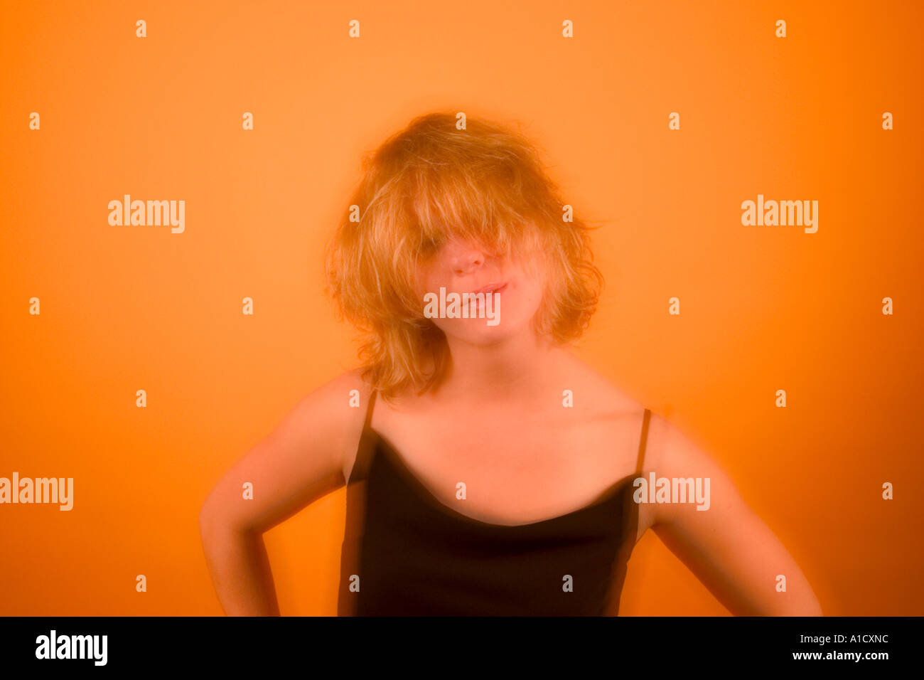 Young blond woman with messy hair posing Model Released Stock Photo Alamy