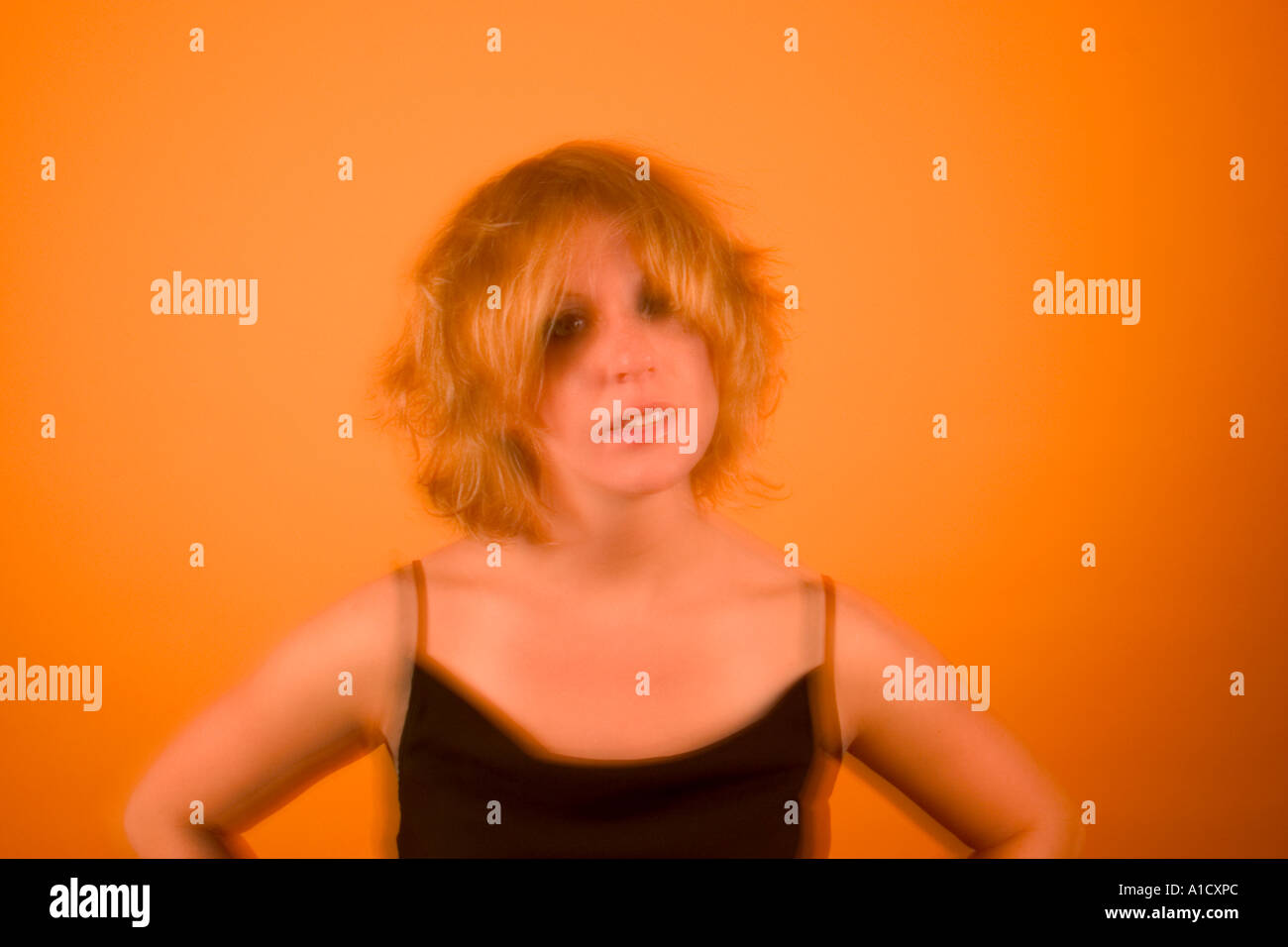 Young blond woman with messy hair posing Model Released Stock Photo Alamy