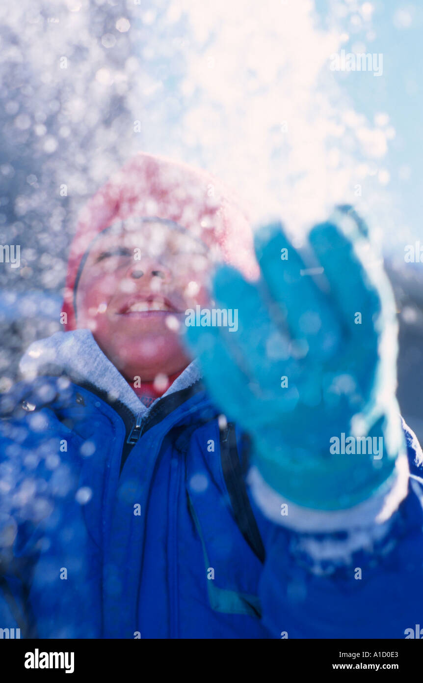 Child in Snow Shower Stock Photo Alamy