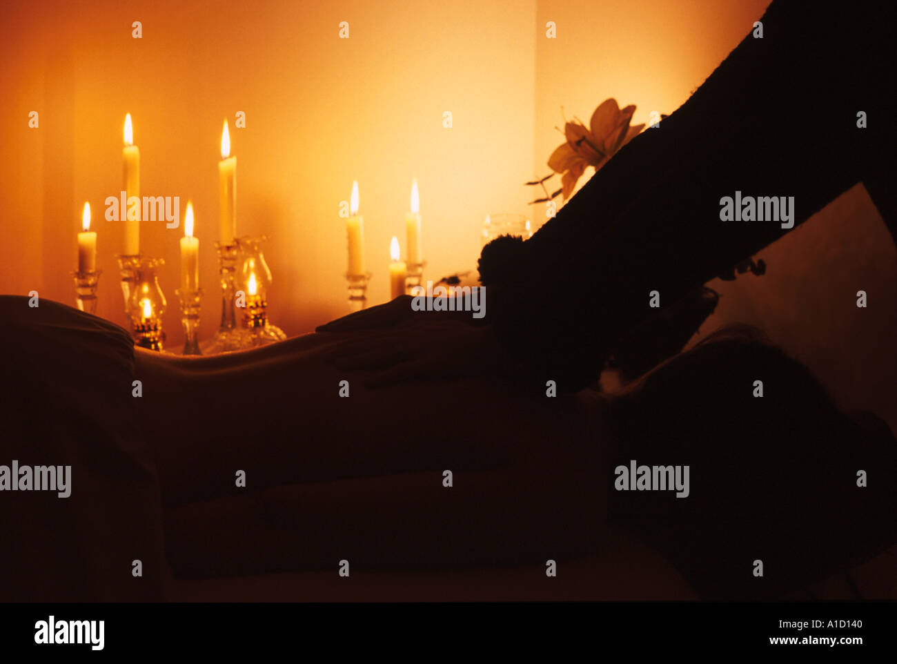 woman getting a massage with candle light Stock Photo