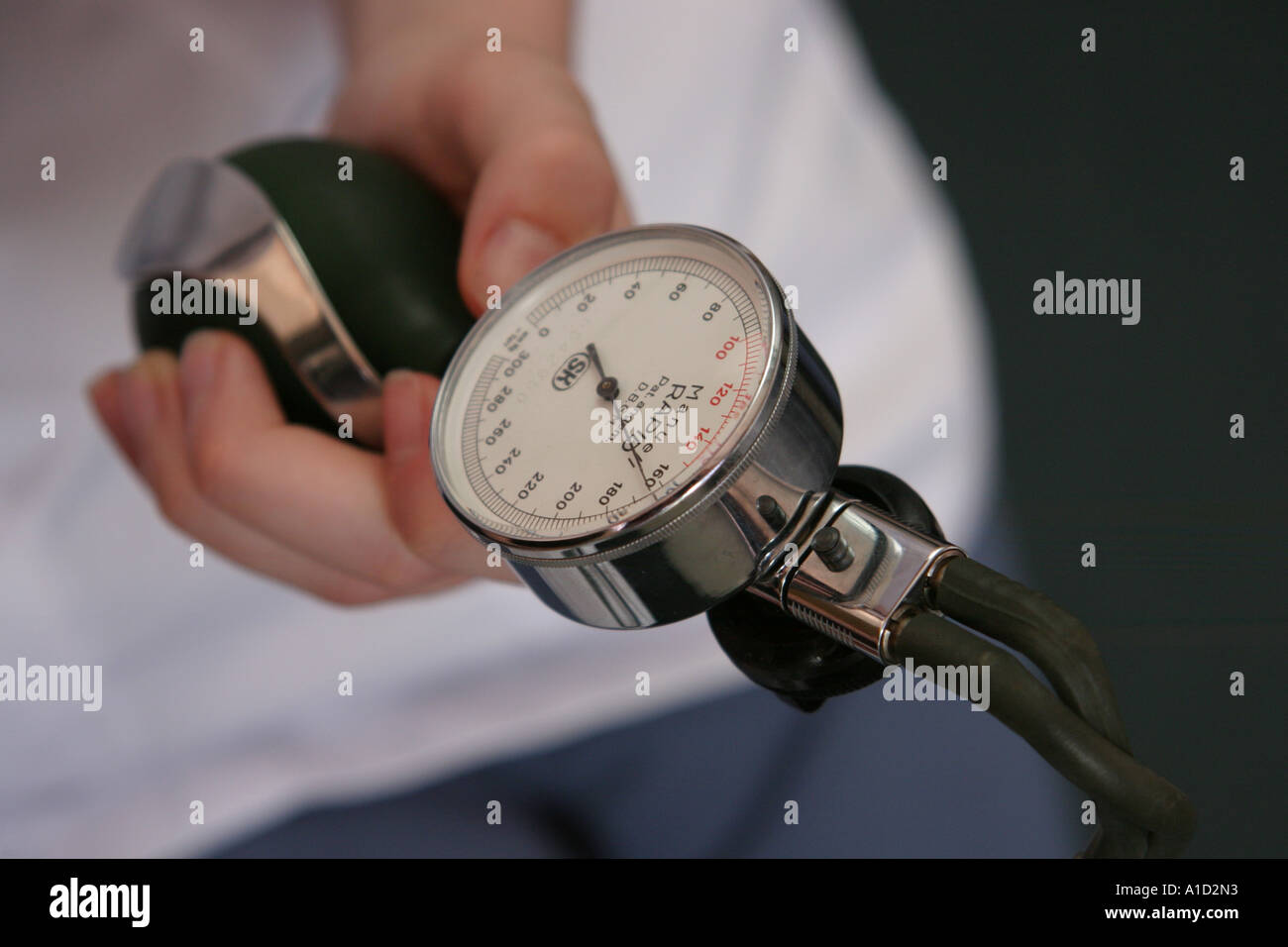 Nurse testing blood pressure on patient Stock Photo Alamy
