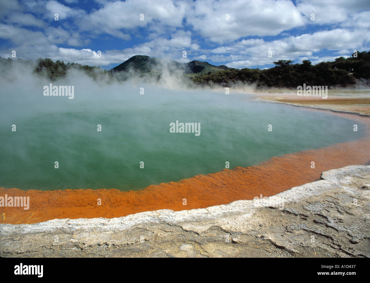 A pool of hot thermal water coloured by mineral deposits from the surrounding rocks Stock Photo
