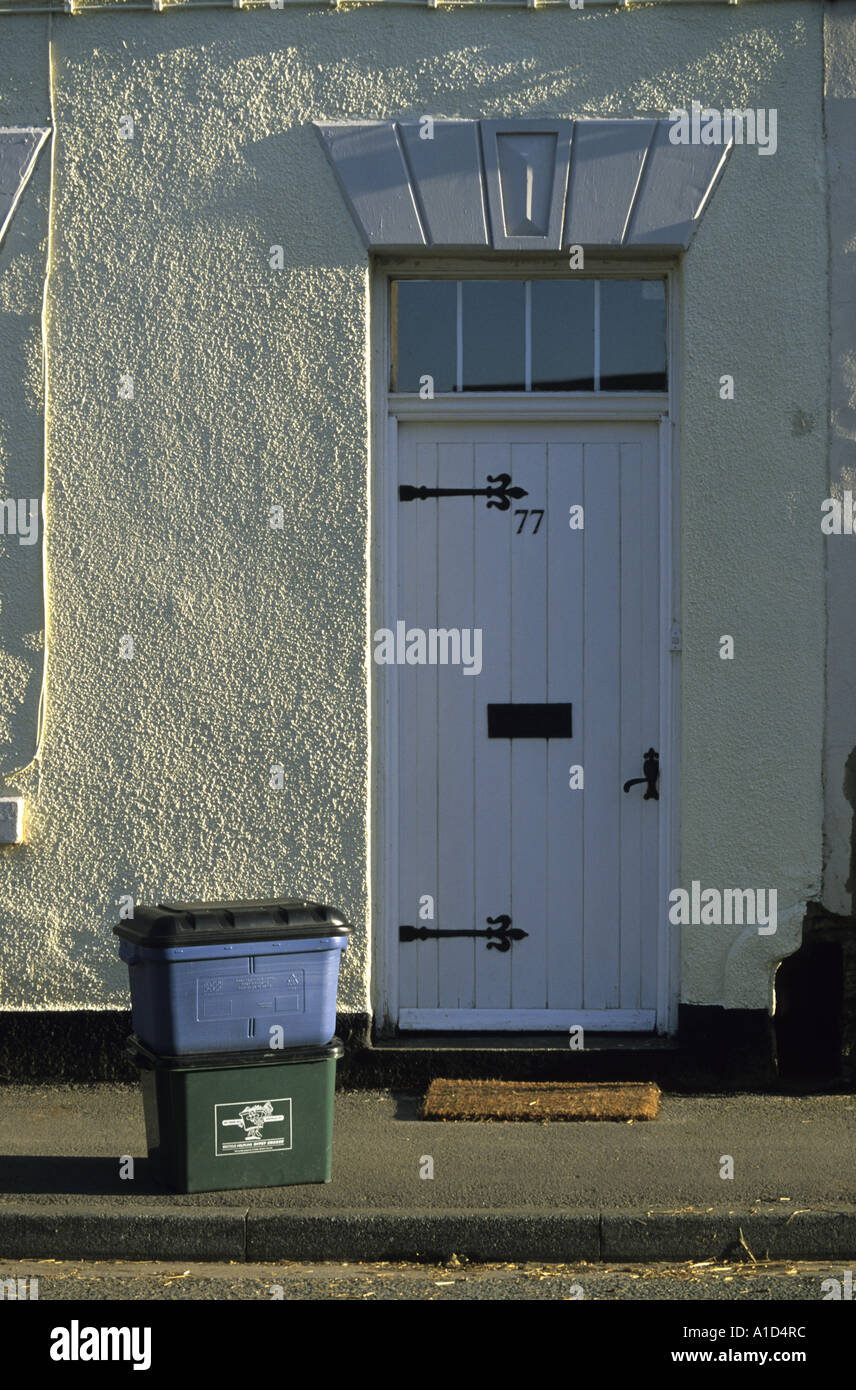 doorstep recyling boxes placed outside house ready for collection for
