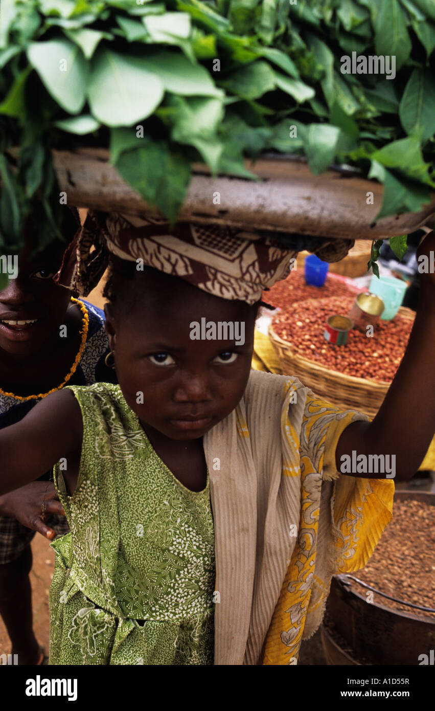 Sierra Leone Market Child selling leaves Stock Photo