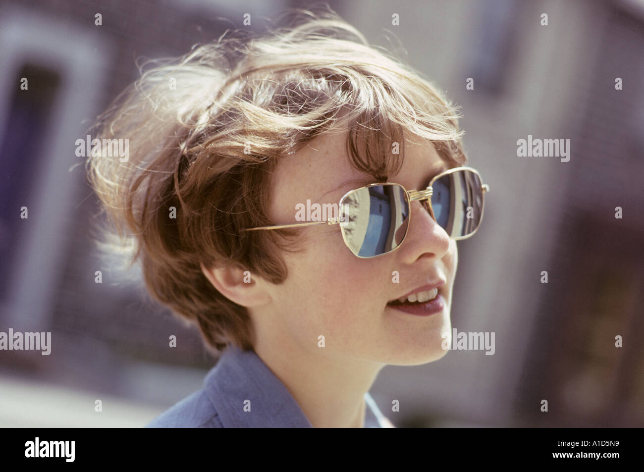 Head shoulders looking up mirror sun glasses smile England UK United