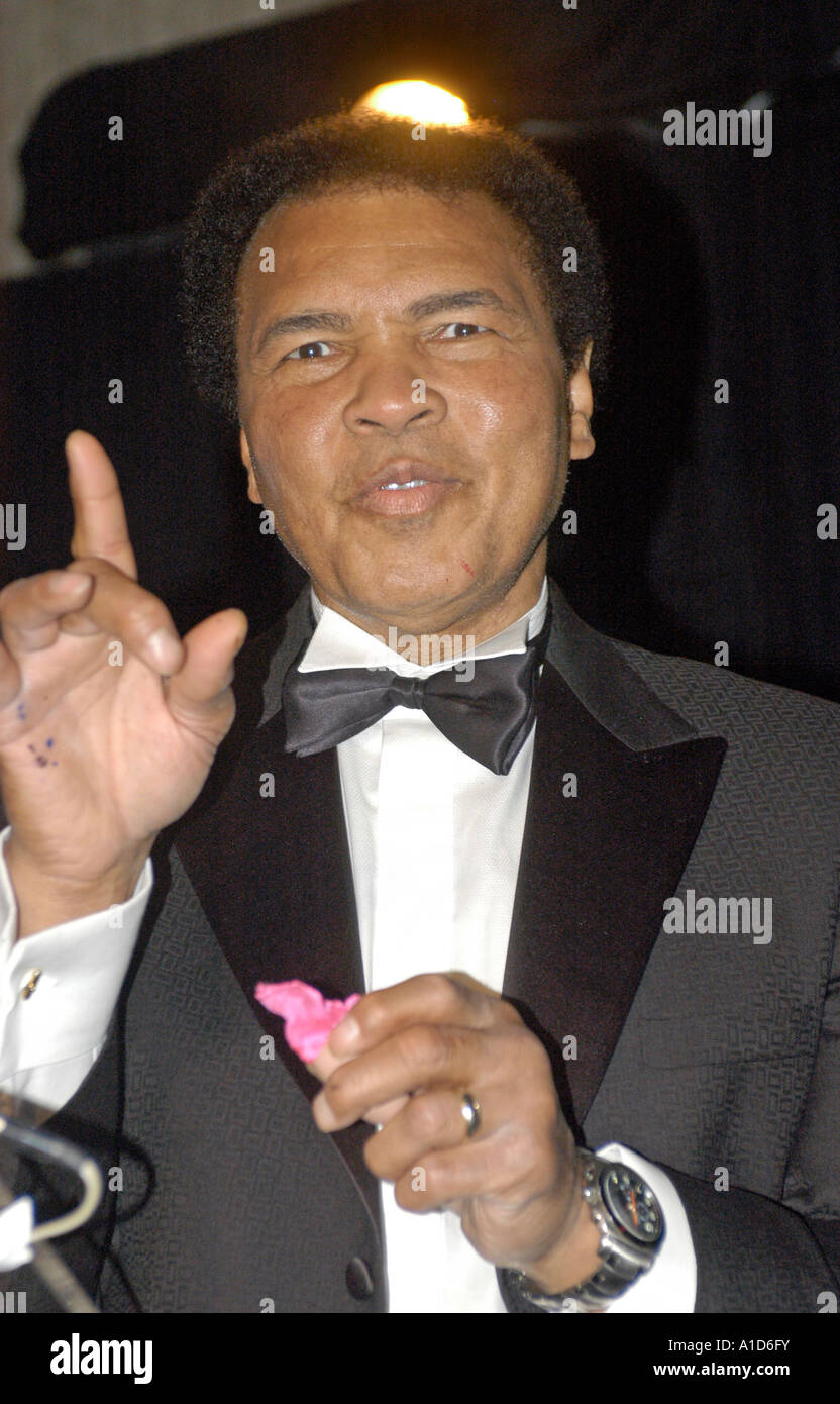 Mohammad Ali performs a magic trick while on stage at the 2004 Kahlil