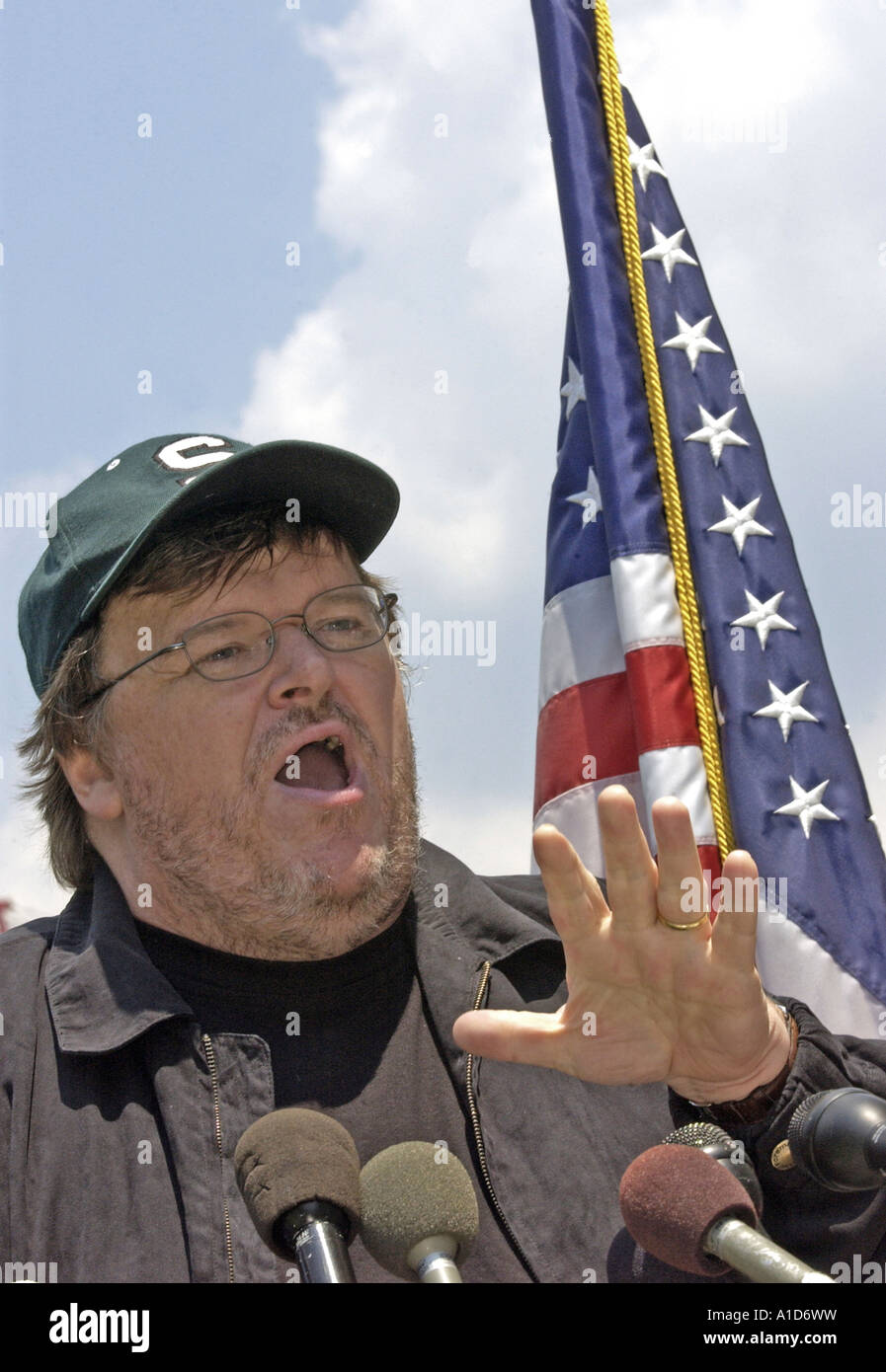 Filmmaker Michael Moore speaks during a news conference on Capitol Hill in Washington. Stock Photo