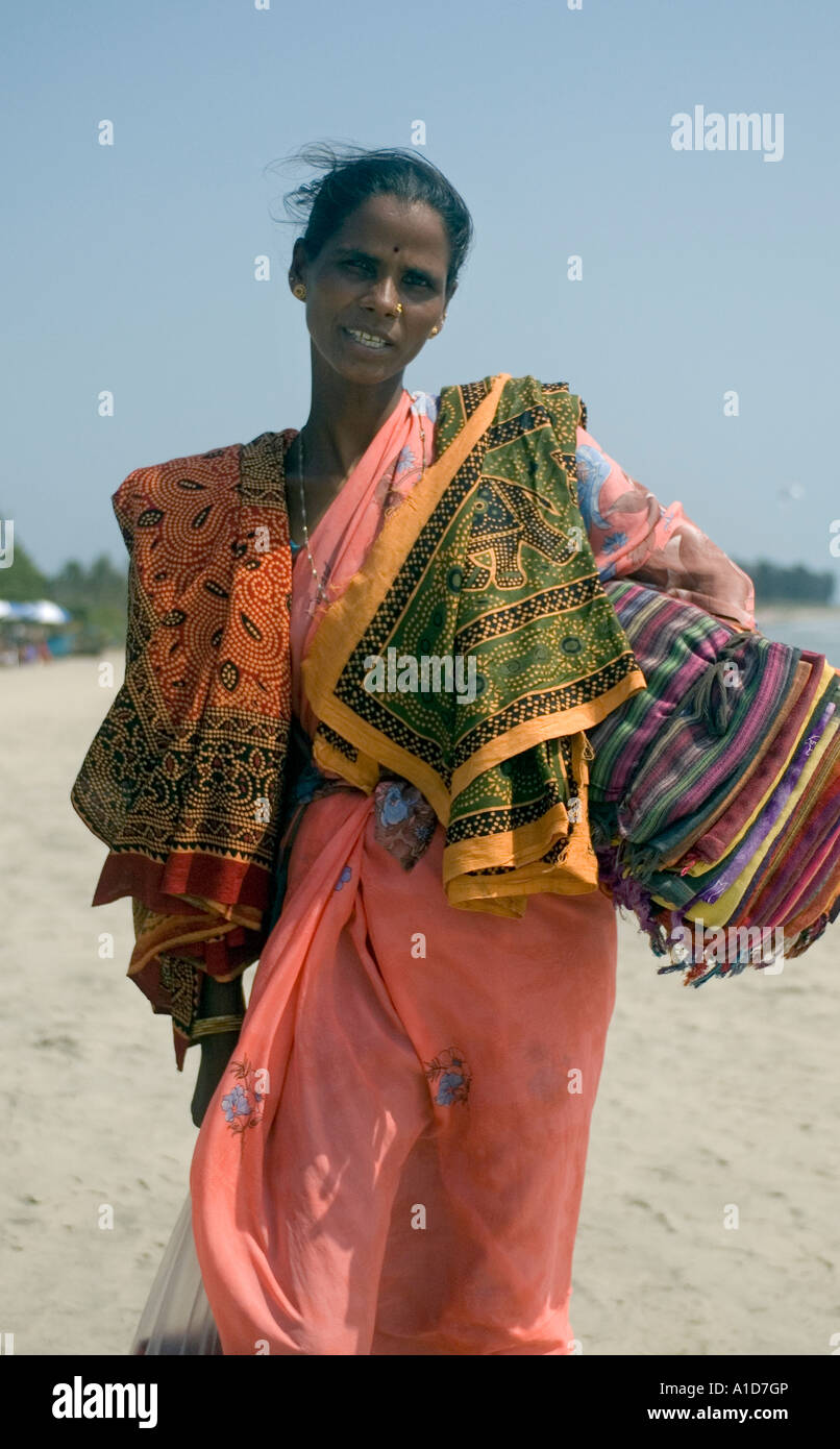 a women selling clothing on the beach in arambol harmal goa india A1D7GP